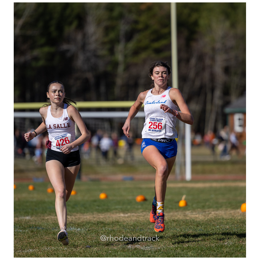 Maeve Casey, La Salle, Charli McCue, Cumberland, at 2024 RIIL Cross Country Class Championships at Ponaganset High School, North Scituate, Rhode Island on October 26, 2024 title=