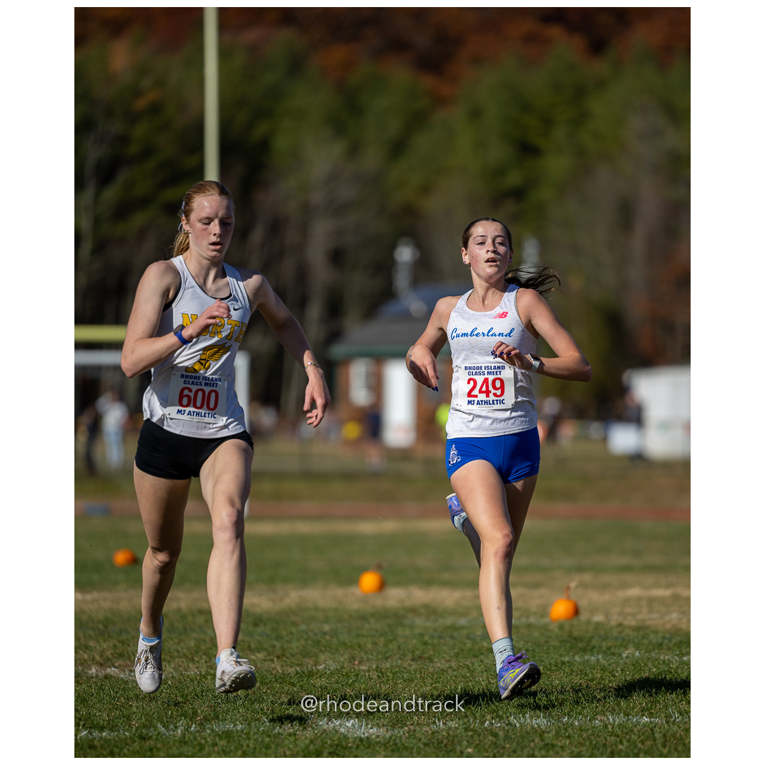 Maura Whitney, North Kingstown, Anna Bianchi, Cumberland, at 2024 RIIL Cross Country Class Championships at Ponaganset High School, North Scituate, Rhode Island on October 26, 2024 title=