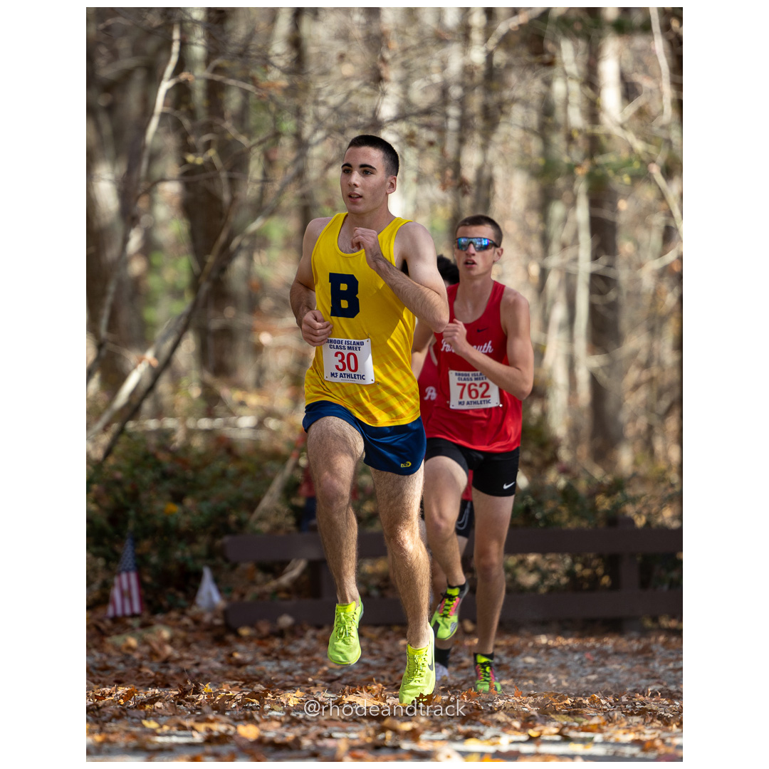 Connor Curran, Barrington, Patrick Orbon, Portsmouth, at 2024 RIIL Cross Country Class Championships at Ponaganset High School, North Scituate, Rhode Island on October 26, 2024 title=