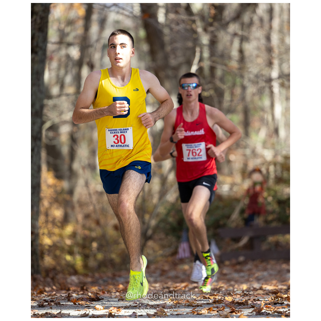 Connor Curran, Barrington, Patrick Orbon, Portsmouth, at 2024 RIIL Cross Country Class Championships at Ponaganset High School, North Scituate, Rhode Island on October 26, 2024 title=