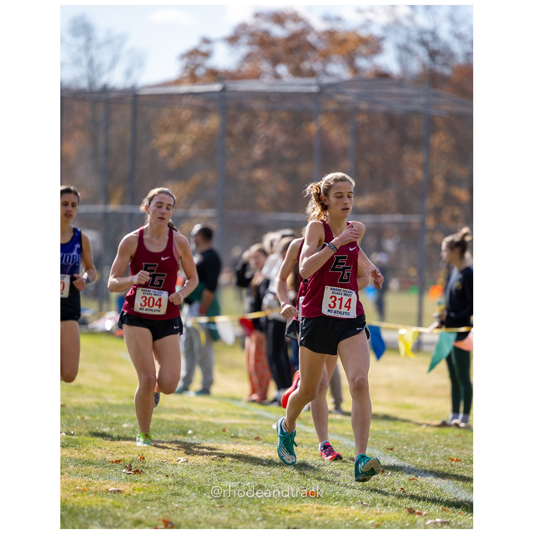 Olive Willis, East Greenwich, Emily Clarke, East Greenwich, at 2024 RIIL Cross Country Class Championships at Ponaganset High School, North Scituate, Rhode Island on October 26, 2024 title=