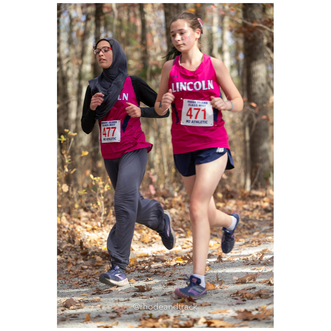 Khadija Kouraj, Lincoln, Meredith Evans, Lincoln, at 2024 RIIL Cross Country Class Championships at Ponaganset High School, North Scituate, Rhode Island on October 26, 2024 title=