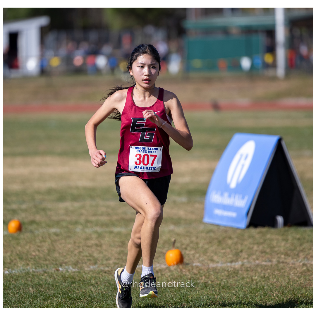 Lindsey Han, East Greenwich, at 2024 RIIL Cross Country Class Championships at Ponaganset High School, North Scituate, Rhode Island on October 26, 2024 title=