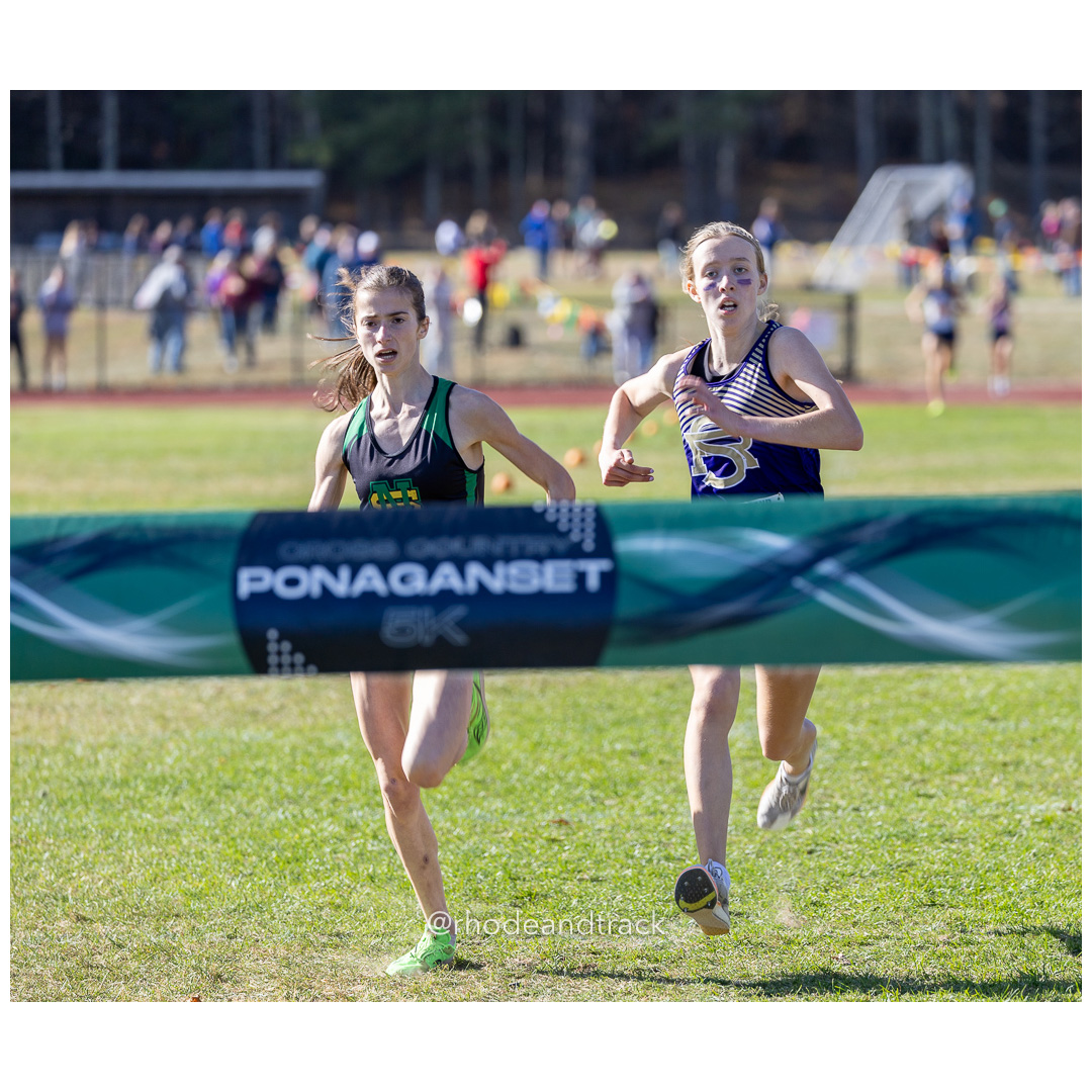 Julia Dowling, North Smithfield, Mackenzie Lickert, St. Raphael, at 2024 RIIL Cross Country Class Championships at Ponaganset High School, North Scituate, Rhode Island on October 26, 2024 title=