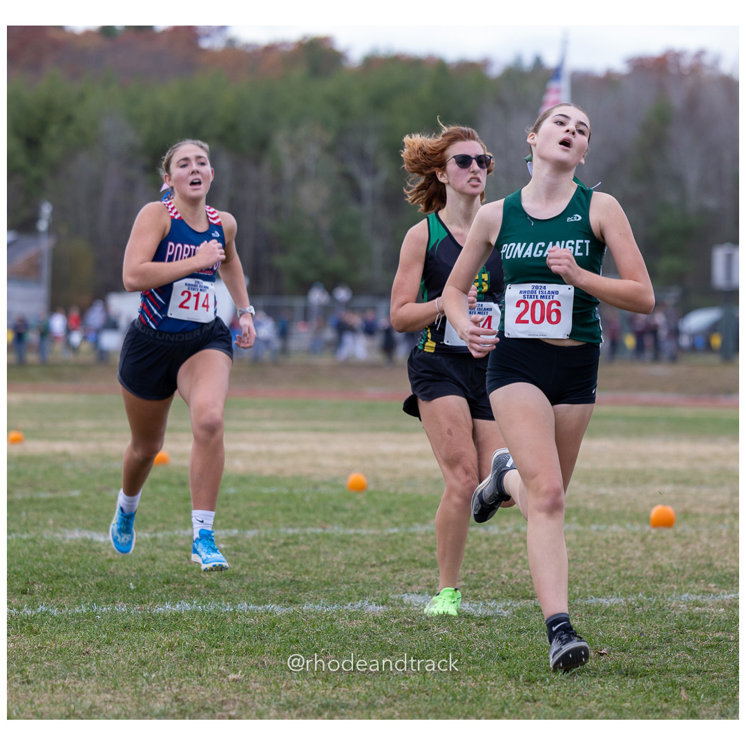Reilly Porado, Portsmouth High School, GR 11 - Riley Shields, Ponaganset High School, GR 9 - 2024 RIIL Cross Country RI State Championship at Ponaganset High School, North Scituate, Rhode Island on November 2, 2024 File: ./dir-girls/241102-241102-2024-RI-Cross-Country-State-Championsips-Ponaganset-496-062A7412.jpg Reilly Porado, Portsmouth High School, GR 11 - Riley Shields, Ponaganset High School, GR 9 - 2024 RIIL Cross Country RI State Championship…