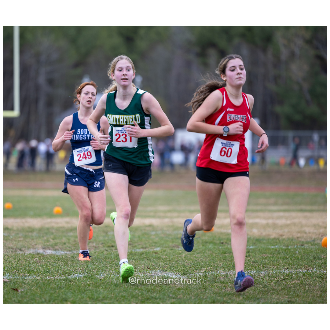 Aine Murrin, South Kingstown High School, GR 12 - MacKenzie Ahern, Smithfield High School, GR 9 - Leah Brosseau, Coventry High School, GR 9 - 2024 RIIL Cross Country RI State Championship at Ponaganset High School, North Scituate, Rhode Island on November 2, 2024 File: ./dir-girls/241102-241102-2024-RI-Cross-Country-State-Championsips-Ponaganset-507-062A7640.jpg Aine Murrin, South Kingstown High School, GR 12 - MacKenzie Ahern, Smithfield High School, GR 9 - Leah Brosseau, Coventry High School, GR 9…