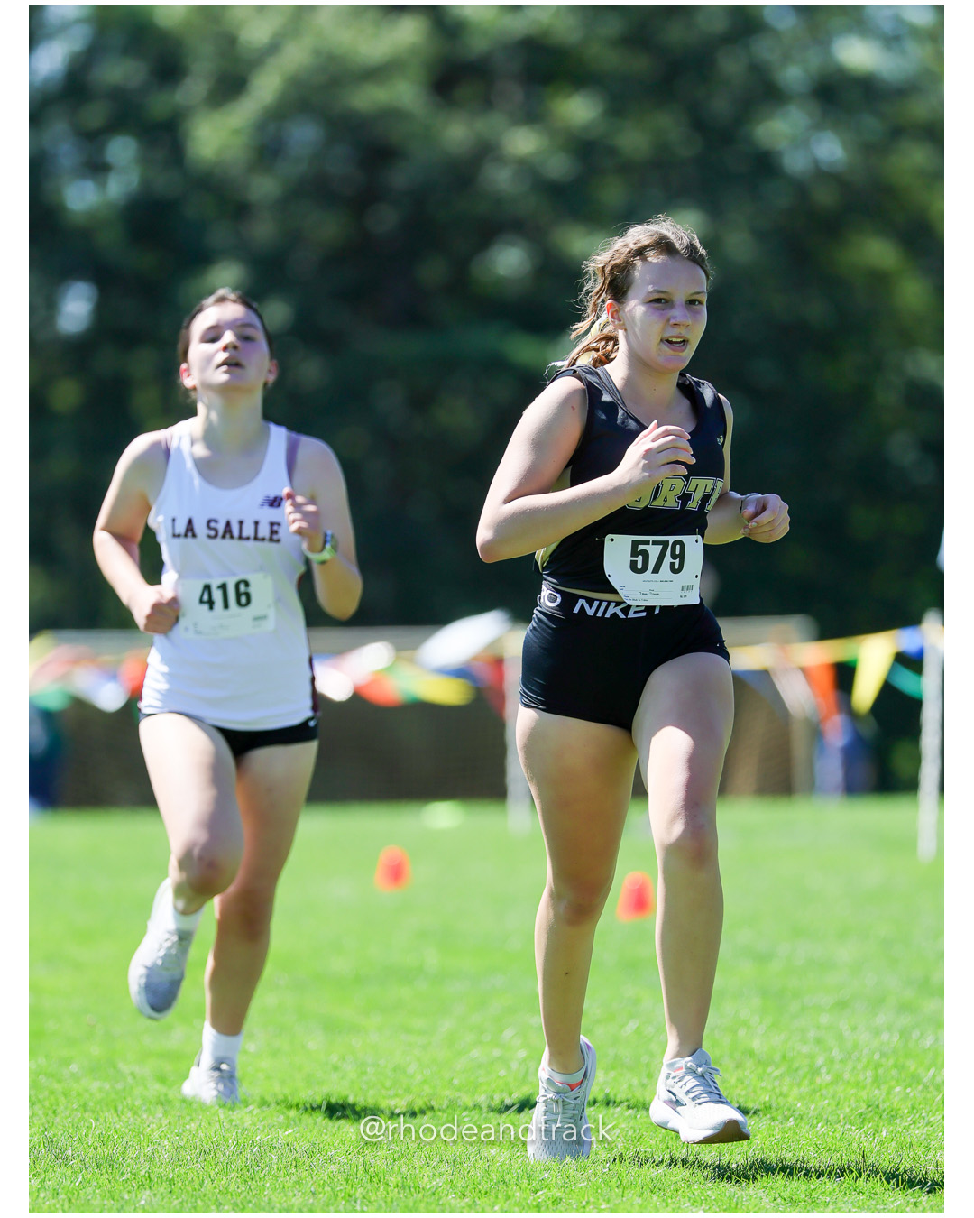 Aliah Valenzuela - La Salle Academy - 22:01.48 - Abbie Obara - North Kingstown High School - 25:03.98 - 2025 Injury Fund Carnival XC Cross Country Race - Deerfield Park, Smithfield RI - August 30 2025 File: ./dir-5-Girls-Freshman-Bob-Leddy-Race/250830-2025-ritca-injury-fund-xc-cross-country-deerfield-park-smithfield-rhode-island-598-296A1641.jpg Aliah Valenzuela - La Salle Academy - 22:01.48 - Abbie Obara - North Kingstown High School - 25:03.98 - 2025 Injury Fund Carnival XC Cross…