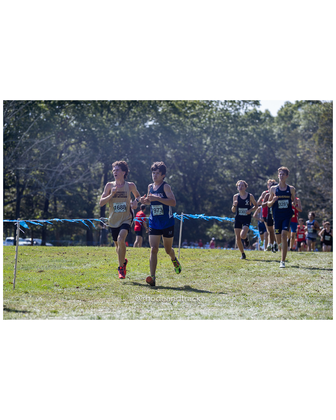 Collin Garrison – Haverhill High School - Benjamin Adams – Merrimack High School - 2025 RI Ocean State XC Invitational - Goddard Memorial Park - Warwick, RI - September 27 2025 File: ./250927-2025-ocean-state-xc-invitational-warwick-ri-174-062A2668.jpg Collin Garrison – Haverhill High School - Benjamin Adams – Merrimack High School - 2025 RI Ocean State XC Invitational - Goddard Memorial P…