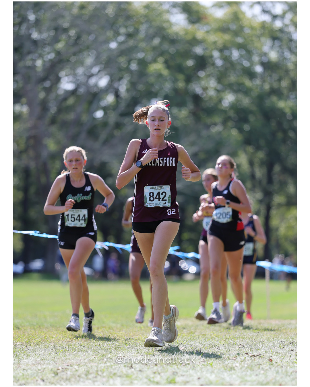 Sienna Brackney – Guilford High School - Neve Lambert – Chelmsford High School - 2025 RI Ocean State XC Invitational - Goddard Memorial Park - Warwick, RI - September 27 2025 File: ./250927-2025-ocean-state-xc-invitational-warwick-ri-358-296A8686.jpg Sienna Brackney – Guilford High School - Neve Lambert – Chelmsford High School - 2025 RI Ocean State XC Invitational - Goddard Memorial Par…