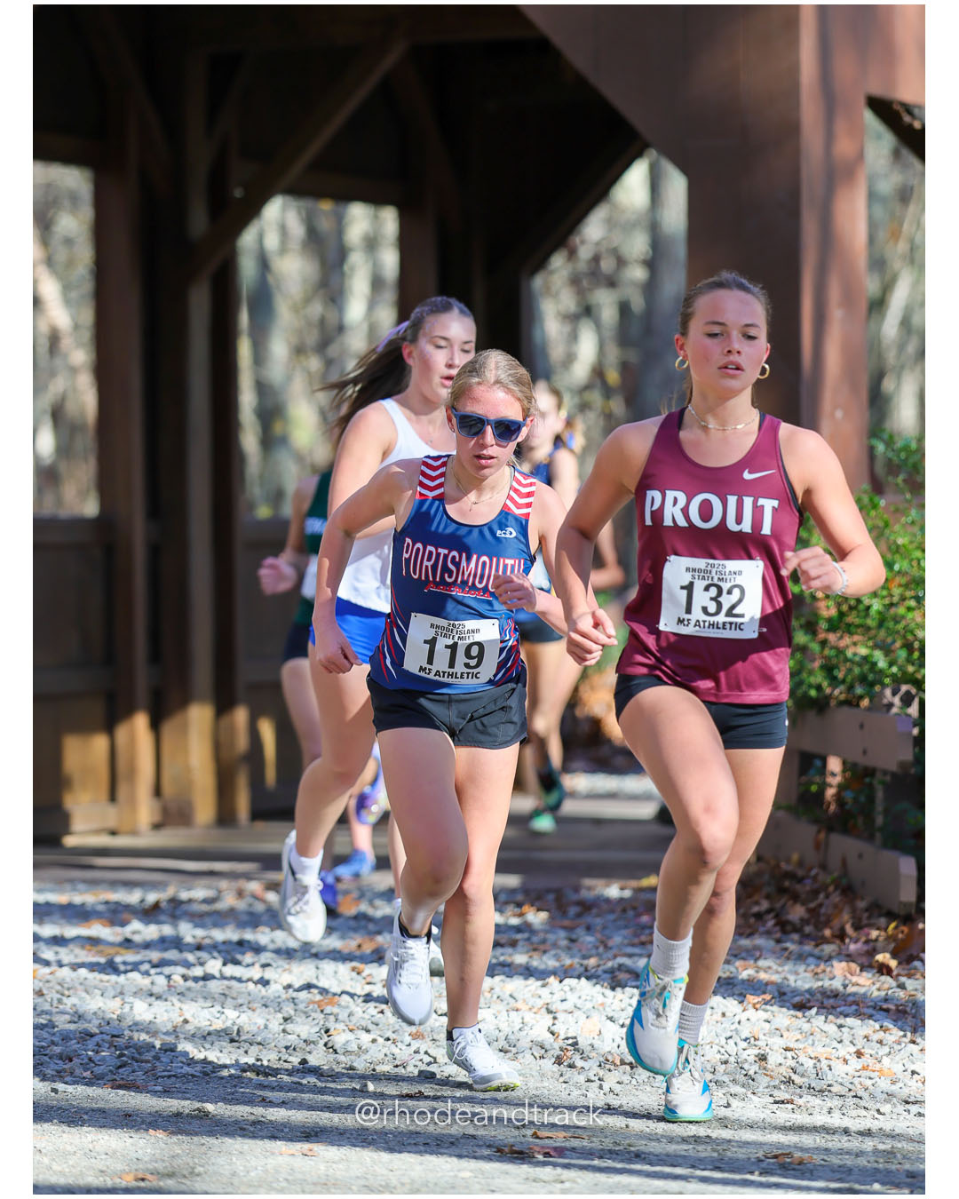 Eva Shumski, Portsmouth High School, 21:31.69, 55 - Mia Bottaro, The Prout School, 21:17.56, 51 - RI Cross Country State Championship - Ponaganset High School - North Scituate, RI - November 1, 2025 File: ./dir-1-Girls-Championship/251101-2025-RI-Cross-Country-State-Championships-Ponaganset-116-296A9450.jpg Eva Shumski, Portsmouth High School, 21:31.69, 55 - Mia Bottaro, The Prout School, 21:17.56, 51 - RI Cross Country State Championship - Pon…