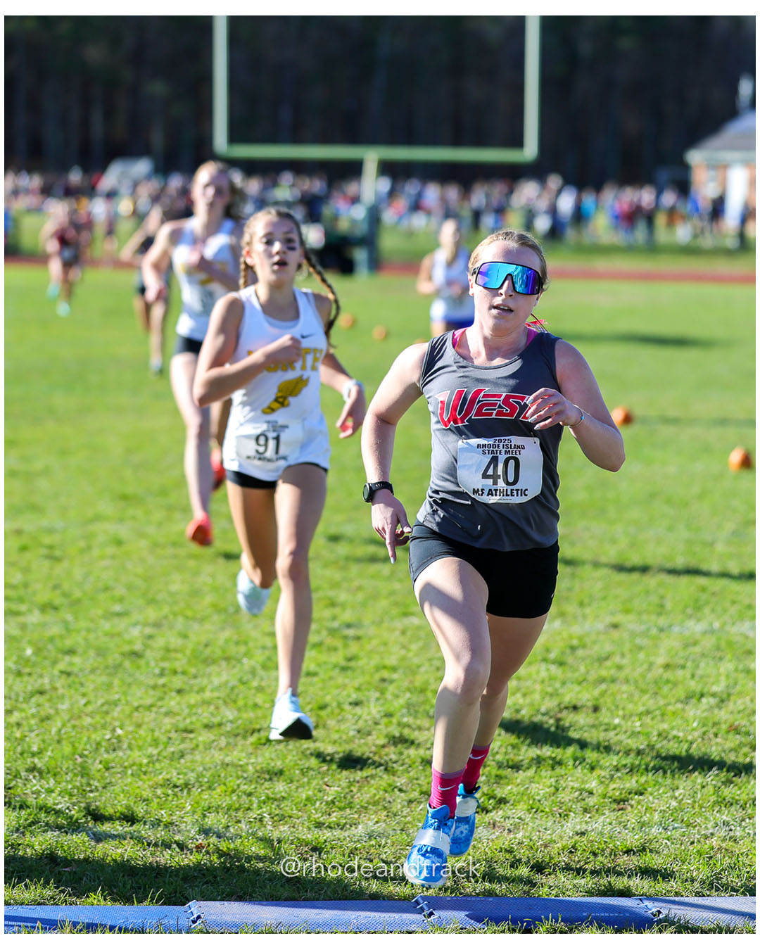 Mackenzie Baker, North Kingstown High School, 20:34.70, 33 - Kristen Fountaine, Cranston West HS, 20:34.19, 32 - RI Cross Country State Championship - Ponaganset High School - North Scituate, RI - November 1, 2025 File: ./dir-1-Girls-Championship/251101-2025-RI-Cross-Country-State-Championships-Ponaganset-256-296A2813.jpg Mackenzie Baker, North Kingstown High School, 20:34.70, 33 - Kristen Fountaine, Cranston West HS, 20:34.19, 32 - RI Cross Country State Cha…