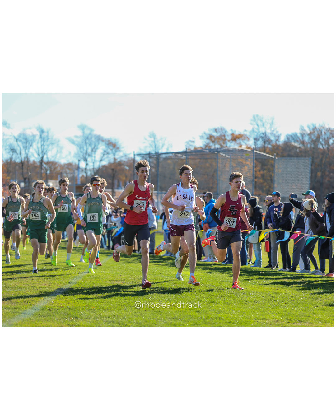 Sean Gray, Portsmouth High School, 15:16.10, 1 - Marshall Vernon, La Salle Academy, 15:30.62, 4 - Andrew Parisi, East Greenwich High School, 16:36.40, 16 - RI Cross Country State Championship - Ponaganset High School - North Scituate, RI - November 1, 2025 File: ./dir-2-Boys-Championship/251101-2025-RI-Cross-Country-State-Championships-Ponaganset-439-296A5461.jpg Sean Gray, Portsmouth High School, 15:16.10, 1 - Marshall Vernon, La Salle Academy, 15:30.62, 4 - Andrew Parisi, East Greenwich High School…