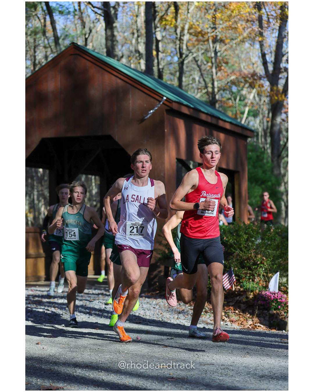 Fred Russell, Bishop Hendricken High School, 15:57.82, 5 - Marshall Vernon, La Salle Academy, 15:30.62, 4 - Sean Gray, Portsmouth High School, 15:16.10, 1 - RI Cross Country State Championship - Ponaganset High School - North Scituate, RI - November 1, 2025 File: ./dir-2-Boys-Championship/251101-2025-RI-Cross-Country-State-Championships-Ponaganset-478-296A5970.jpg Fred Russell, Bishop Hendricken High School, 15:57.82, 5 - Marshall Vernon, La Salle Academy, 15:30.62, 4 - Sean Gray, Portsmouth High Scho…