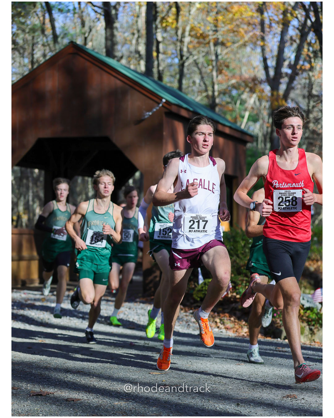 Fred Russell, Bishop Hendricken High School, 15:57.82, 5 - Marshall Vernon, La Salle Academy, 15:30.62, 4 - Sean Gray, Portsmouth High School, 15:16.10, 1 - RI Cross Country State Championship - Ponaganset High School - North Scituate, RI - November 1, 2025 File: ./dir-2-Boys-Championship/251101-2025-RI-Cross-Country-State-Championships-Ponaganset-479-296A5985.jpg Fred Russell, Bishop Hendricken High School, 15:57.82, 5 - Marshall Vernon, La Salle Academy, 15:30.62, 4 - Sean Gray, Portsmouth High Scho…