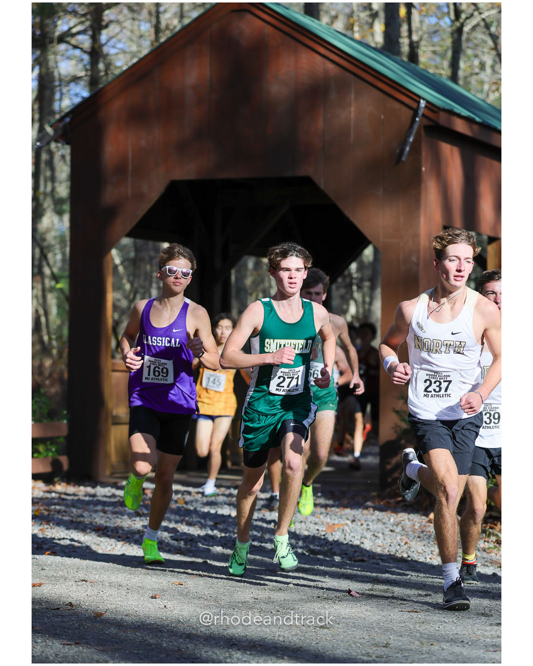 Noah Johnson, Classical High School, 17:02.39, 27 - Mason Smith, Smithfield High School, 18:02.42, 59 - Colson Place, North Kingstown High School, 17:02.09, 26 - RI Cross Country State Championship - Ponaganset High School - North Scituate, RI - November 1, 2025 File: ./dir-2-Boys-Championship/251101-2025-RI-Cross-Country-State-Championships-Ponaganset-494-296A6194.jpg Noah Johnson, Classical High School, 17:02.39, 27 - Mason Smith, Smithfield High School, 18:02.42, 59 - Colson Place, North Kingstown High…