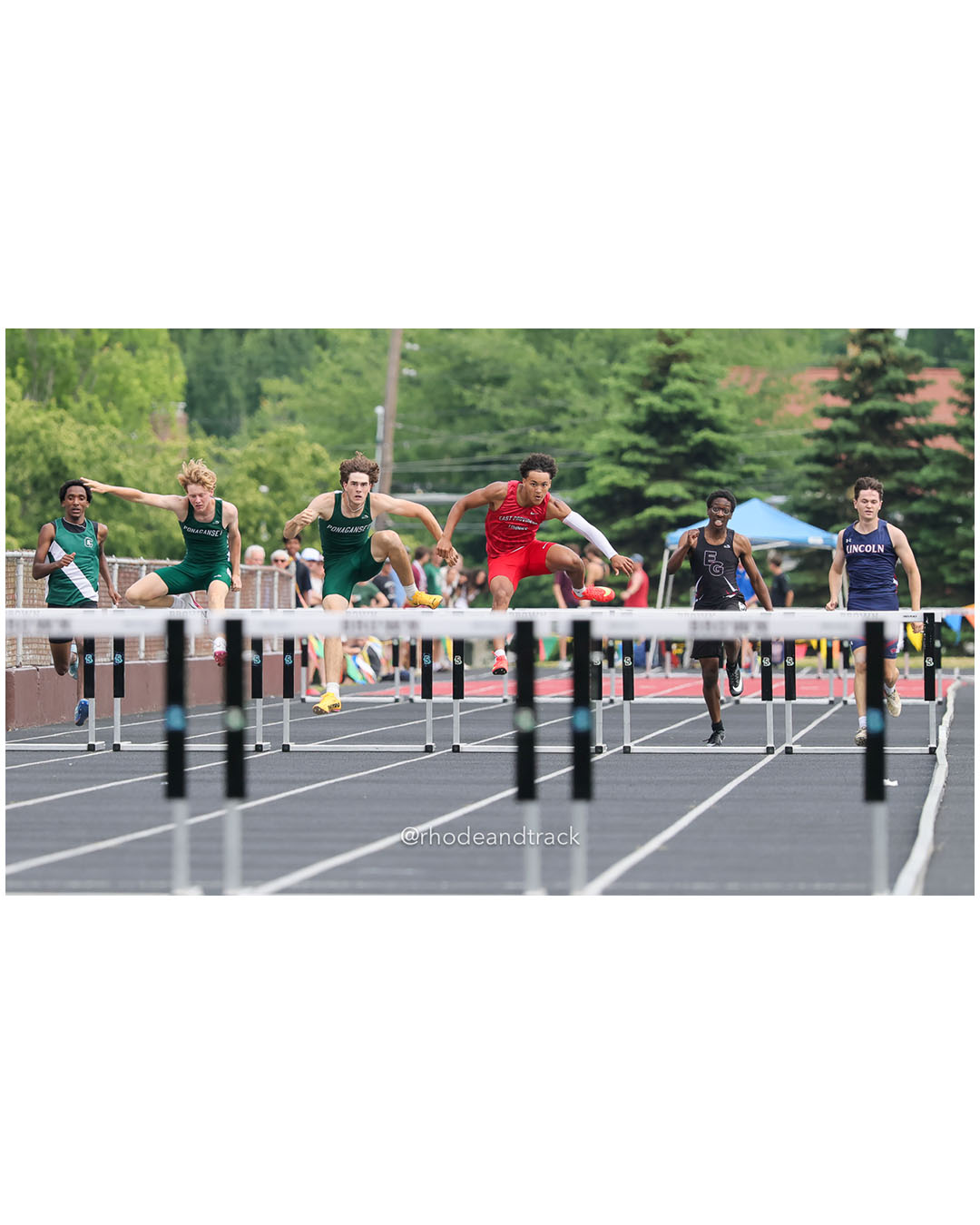 Paxton Allen, Ponaganset High School, 12 - Araoluwa Adetunji, East Greenwich High School, 11 - Daniel Perez, Cranston East High School, 12 - Ryan McEntee, Ponaganset High School, 12 - Holden Lambert, Lincoln High School, 12 - Isaac Rodriguez, East Providence High School, 11 - 2026 RI Outdoor Track and Field State Championships - Brown Stadium - Providence, Rhode Island - June 06, 2026 File: ./dir-300-Hurdles/260606-2026-RI-Outdoor-Track-And-Field-State-Championships-Brown-631-296A7048.jpg Paxton Allen, Ponaganset High School, 12 - Araoluwa Adetunji, East Greenwich High School, 11 - Daniel Perez, Cranston East High School, 12…