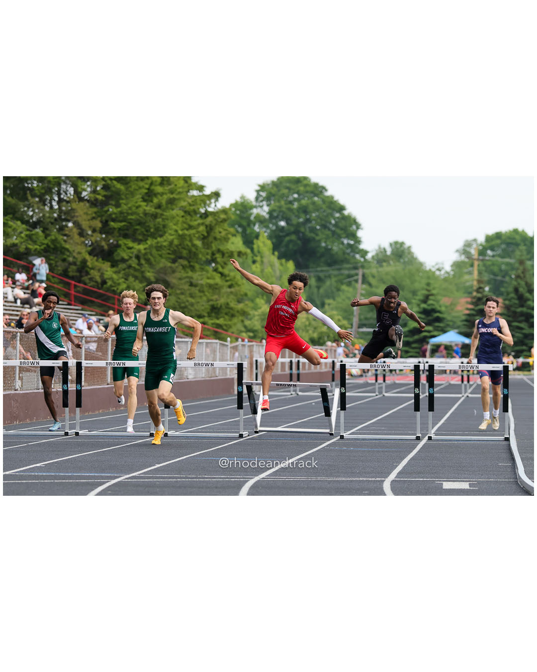 Paxton Allen, Ponaganset High School, 12 - Araoluwa Adetunji, East Greenwich High School, 11 - Daniel Perez, Cranston East High School, 12 - Ryan McEntee, Ponaganset High School, 12 - Holden Lambert, Lincoln High School, 12 - Isaac Rodriguez, East Providence High School, 11 - 2026 RI Outdoor Track and Field State Championships - Brown Stadium - Providence, Rhode Island - June 06, 2026 File: ./dir-300-Hurdles/260606-2026-RI-Outdoor-Track-And-Field-State-Championships-Brown-633-296A7105.jpg Paxton Allen, Ponaganset High School, 12 - Araoluwa Adetunji, East Greenwich High School, 11 - Daniel Perez, Cranston East High School, 12…
