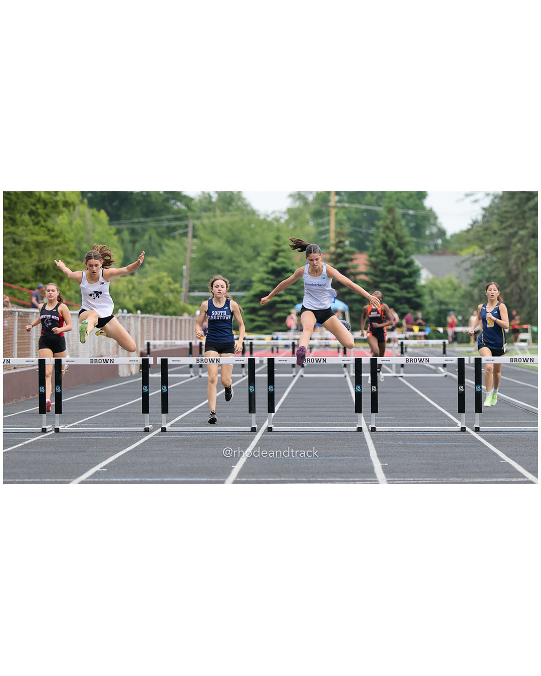Madeline Coyne, Cumberland, 11 - Sybil Lorincz, Moses Brown School, 9 - Luciana Starkey, South Kingstown High School, 9 - Maya Cicchitelli, Cranston West HS, 11 - Soo Yeon Park, Barrington High School, 10 - 2026 RI Outdoor Track and Field State Championships - Brown Stadium - Providence, Rhode Island - June 06, 2026 File: ./dir-300-Hurdles/260606-2026-RI-Outdoor-Track-And-Field-State-Championships-Brown-648-296A7957.jpg Madeline Coyne, Cumberland, 11 - Sybil Lorincz, Moses Brown School, 9 - Luciana Starkey, South Kingstown High School, 9 - Maya Cicchitelli,…