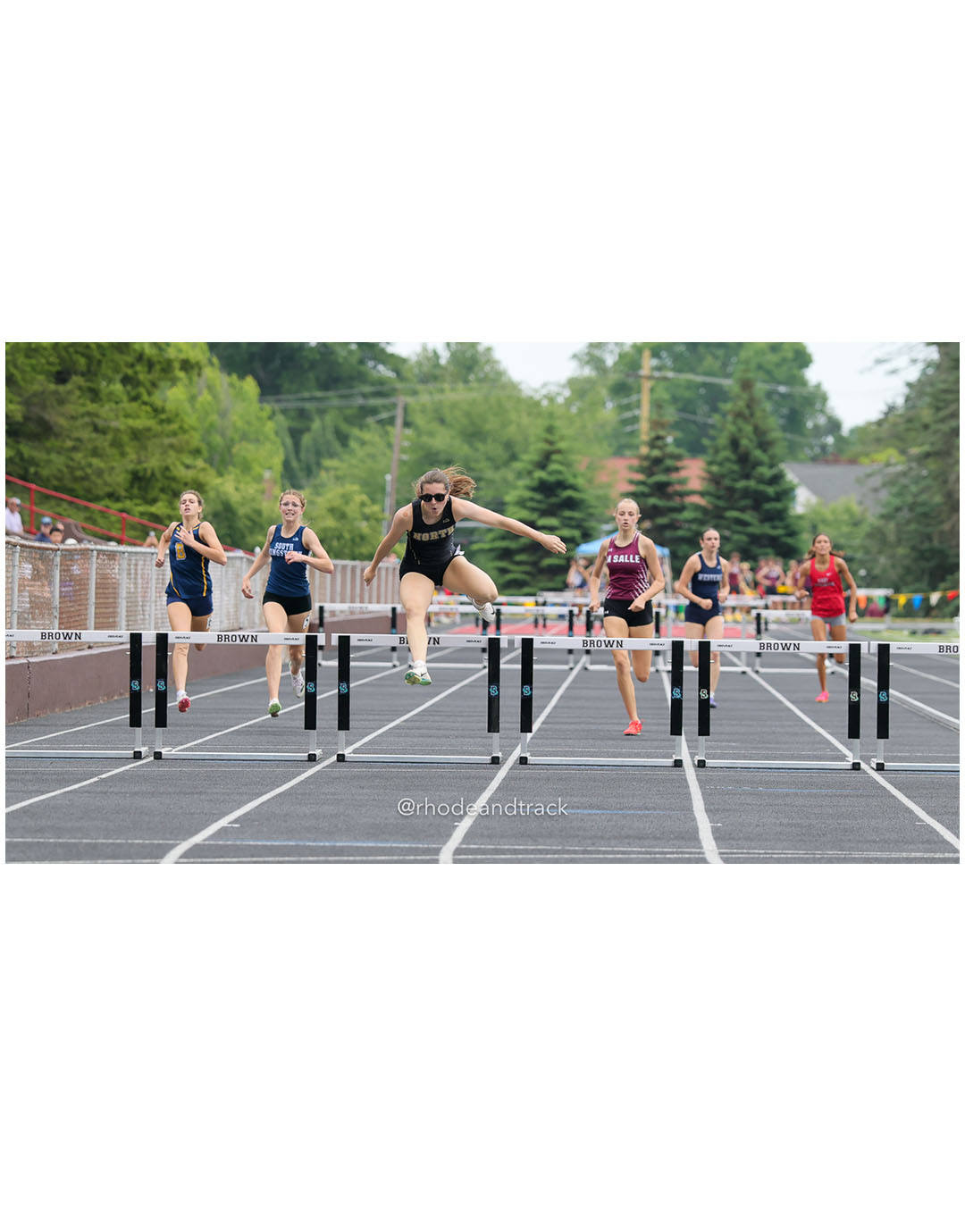 Reagan Farrell, North Kingstown High School, 10 - Bria Bender, South Kingstown High School, 9 - Jillian Lewis, La Salle Academy, 11 - Dacia Gingerella, Westerly High School, 12 - Charlotte Farrell, Barrington High School, 10 - 2026 RI Outdoor Track and Field State Championships - Brown Stadium - Providence, Rhode Island - June 06, 2026 File: ./dir-300-Hurdles/260606-2026-RI-Outdoor-Track-And-Field-State-Championships-Brown-656-296A8753.jpg Reagan Farrell, North Kingstown High School, 10 - Bria Bender, South Kingstown High School, 9 - Jillian Lewis, La Salle Academy, 11 - Dacia…