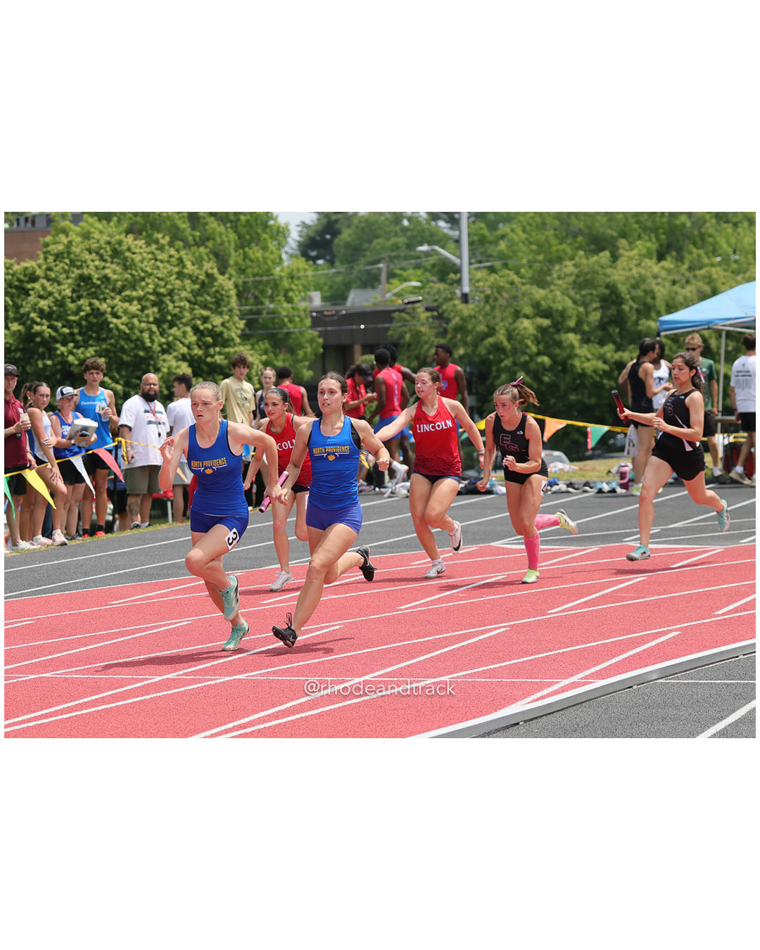 North Providence High School, North Providence High School - East Greenwich High School, East Greenwich High School - Lincoln - 2026 RI Outdoor Track and Field Championships - Brown Stadium - Providence, Rhode Island - June 06, 2026 File: ./dir-4x100/260606-2026-RI-Outdoor-Track-And-Field-State-Championships-Brown-389-296A6589.jpg North Providence High School, North Providence High School - East Greenwich High School, East Greenwich High School - Lincoln - 2026 RI Out…