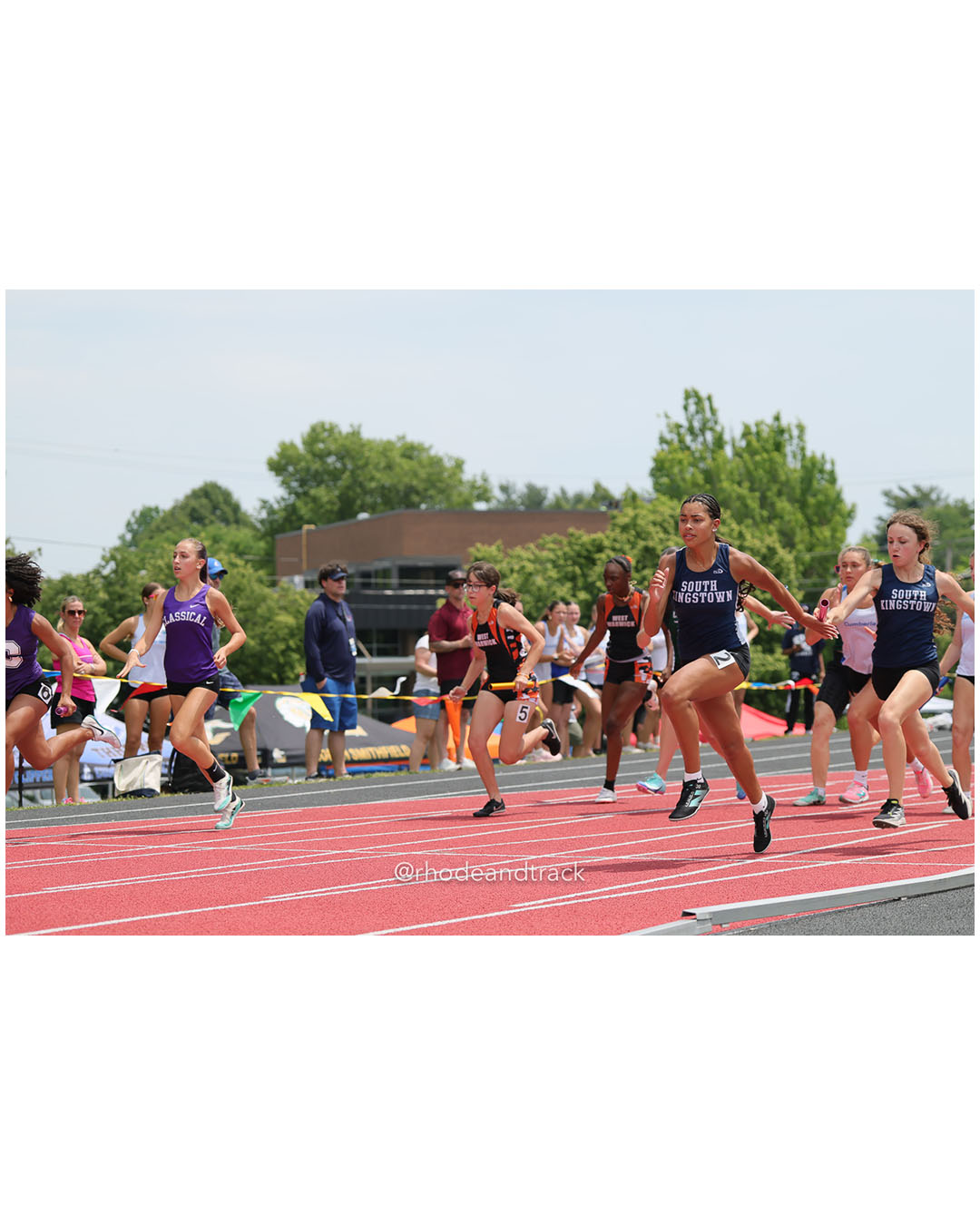 Classical High School, Classical High School - West Warwick High School, West Warwick High School - South Kingstown High School, South Kingstown High School - 2026 RI Outdoor Track and Field Championships - Brown Stadium - Providence, Rhode Island - June 06, 2026 File: ./dir-4x100/260606-2026-RI-Outdoor-Track-And-Field-State-Championships-Brown-398-296A6671.jpg Classical High School, Classical High School - West Warwick High School, West Warwick High School - South Kingstown High School, South King…