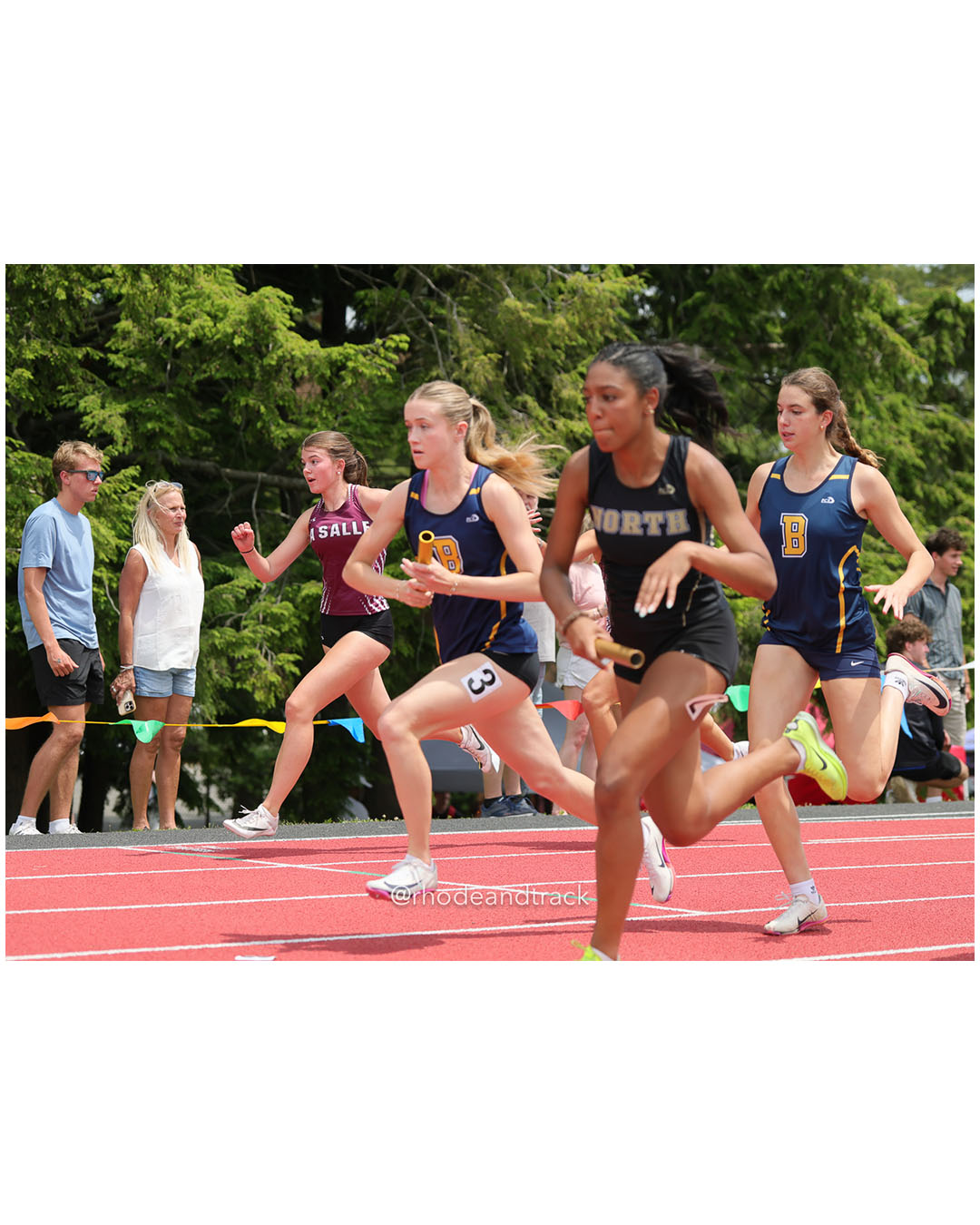 La Salle Academy, La Salle Academy - Barrington High School, Barrington High School - North Kingstown High School, North Kingstown High School - 2026 RI Outdoor Track and Field Championships - Brown Stadium - Providence, Rhode Island - June 06, 2026 File: ./dir-4x100/260606-2026-RI-Outdoor-Track-And-Field-State-Championships-Brown-409-296A6848.jpg La Salle Academy, La Salle Academy - Barrington High School, Barrington High School - North Kingstown High School, North Kingstown High Sch…