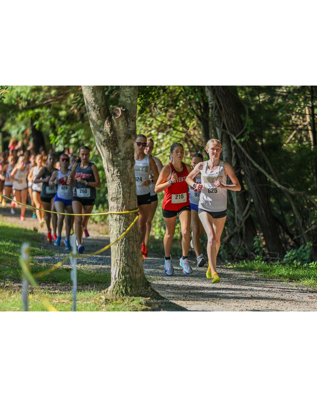 #215 Molly Richardson, Coventry High School, 5k Run - Girls (Roy), P3, 19:35.47; #625 Abbie Tighe, North Kingstown High School, 5k Run - Girls (Roy), P2, 19:31.96 - #625 Abbie Tighe, North Kingstown High School, 5k Run - Girls (Roy), P2, 19:31.96 - 2026 Injury Fund Carnival XC - Deerfield Park - Greenville, Rhode Island - September 05, 2026 File: ./dir-2-5k_Run-Girls-Roy/260905-2026-injury-fund-xc-deerfield-park-175-398A5039.jpg #215 Molly Richardson, Coventry High School, 5k Run - Girls (Roy), P3, 19:35.47; #625 Abbie Tighe, North Kingstown High School, 5k Run - Gi…