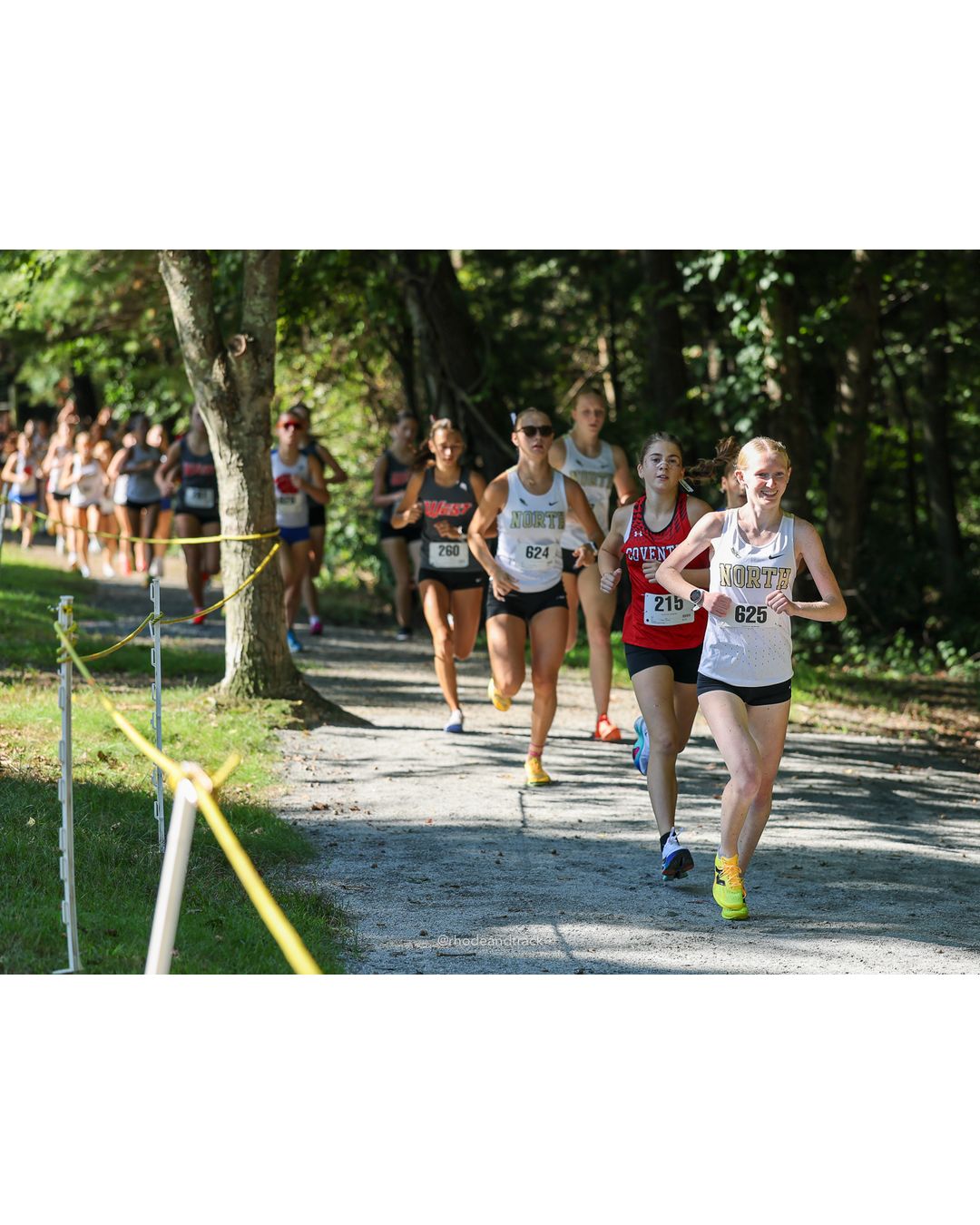 #625 Abbie Tighe, North Kingstown High School, 5k Run - Girls (Roy), P2, 19:31.96; #624 Lucy Stowe, North Kingstown High School, 5k Run - Girls (Roy), P1, 19:23.76 - #625 Abbie Tighe, North Kingstown High School, 5k Run - Girls (Roy), P2, 19:31.96; #624 Lucy Stowe, North Kingstown High School, 5k Run - Girls (Roy), P1, 19:23.76 - 2026 Injury Fund Carnival XC - Deerfield Park - Greenville, Rhode Island - September 05, 2026 File: ./dir-2-5k_Run-Girls-Roy/260905-2026-injury-fund-xc-deerfield-park-176-398A5067.jpg #625 Abbie Tighe, North Kingstown High School, 5k Run - Girls (Roy), P2, 19:31.96; #624 Lucy Stowe, North Kingstown High School, 5k Run - G…
