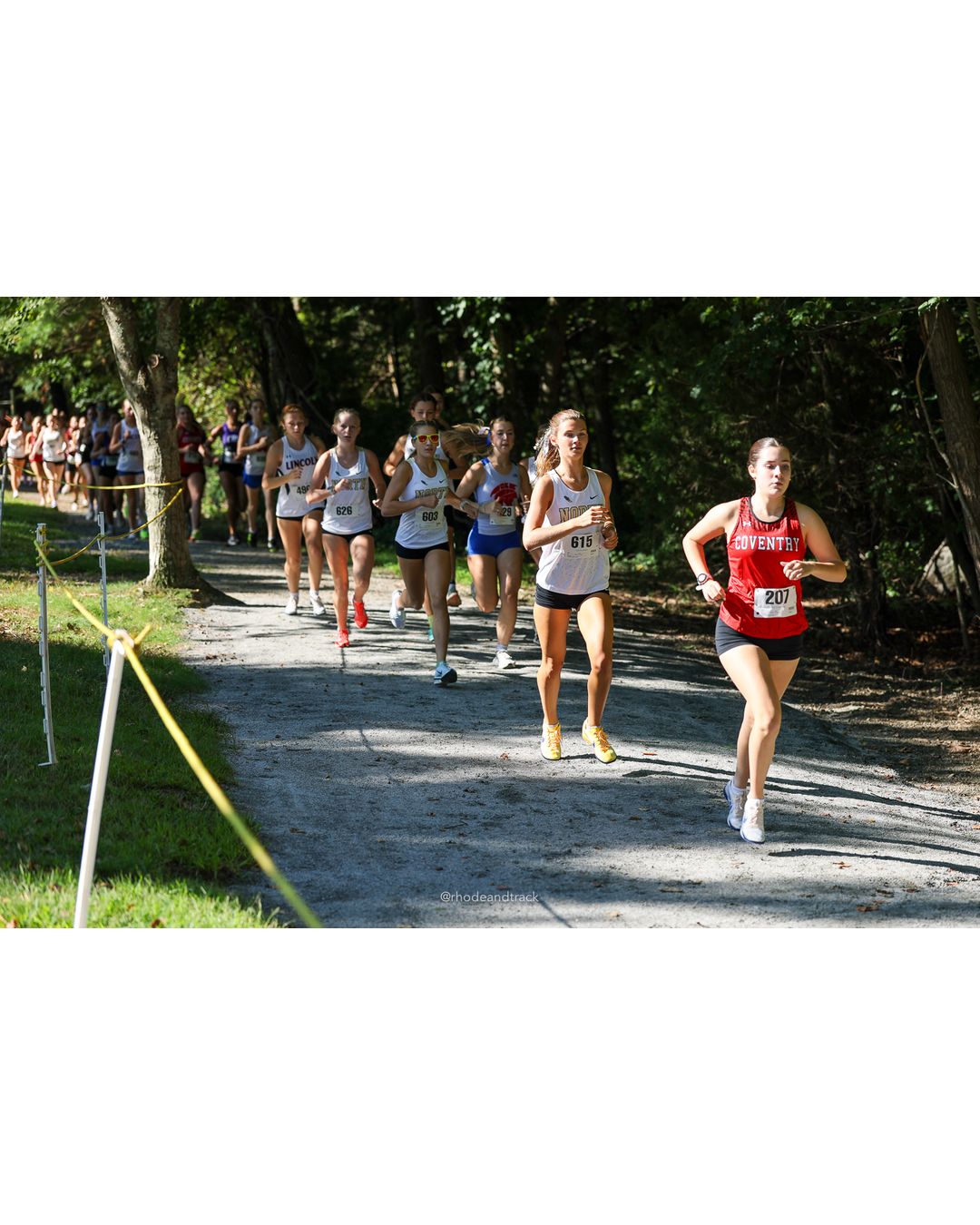 #207 Leah Brosseau, Coventry High School, 5k Run - Girls (Roy), P20, 22:39.11; #615 Anna Mansfield, North Kingstown High School, 5k Run - Girls (Roy), P9, 21:39.64; #626 Avrie Tighe, North Kingstown High School, 5k Run - Girls (Roy), P11, 21:40.67 - #207 Leah Brosseau, Coventry High School, 5k Run - Girls (Roy), P20, 22:39.11; #626 Avrie Tighe, North Kingstown High School, 5k Run - Girls (Roy), P11, 21:40.67 - 2026 Injury Fund Carnival XC - Deerfield Park - Greenville, Rhode Island - September 05, 2026 File: ./dir-2-5k_Run-Girls-Roy/260905-2026-injury-fund-xc-deerfield-park-182-398A5134.jpg #207 Leah Brosseau, Coventry High School, 5k Run - Girls (Roy), P20, 22:39.11; #615 Anna Mansfield, North Kingstown High School, 5k Run - G…