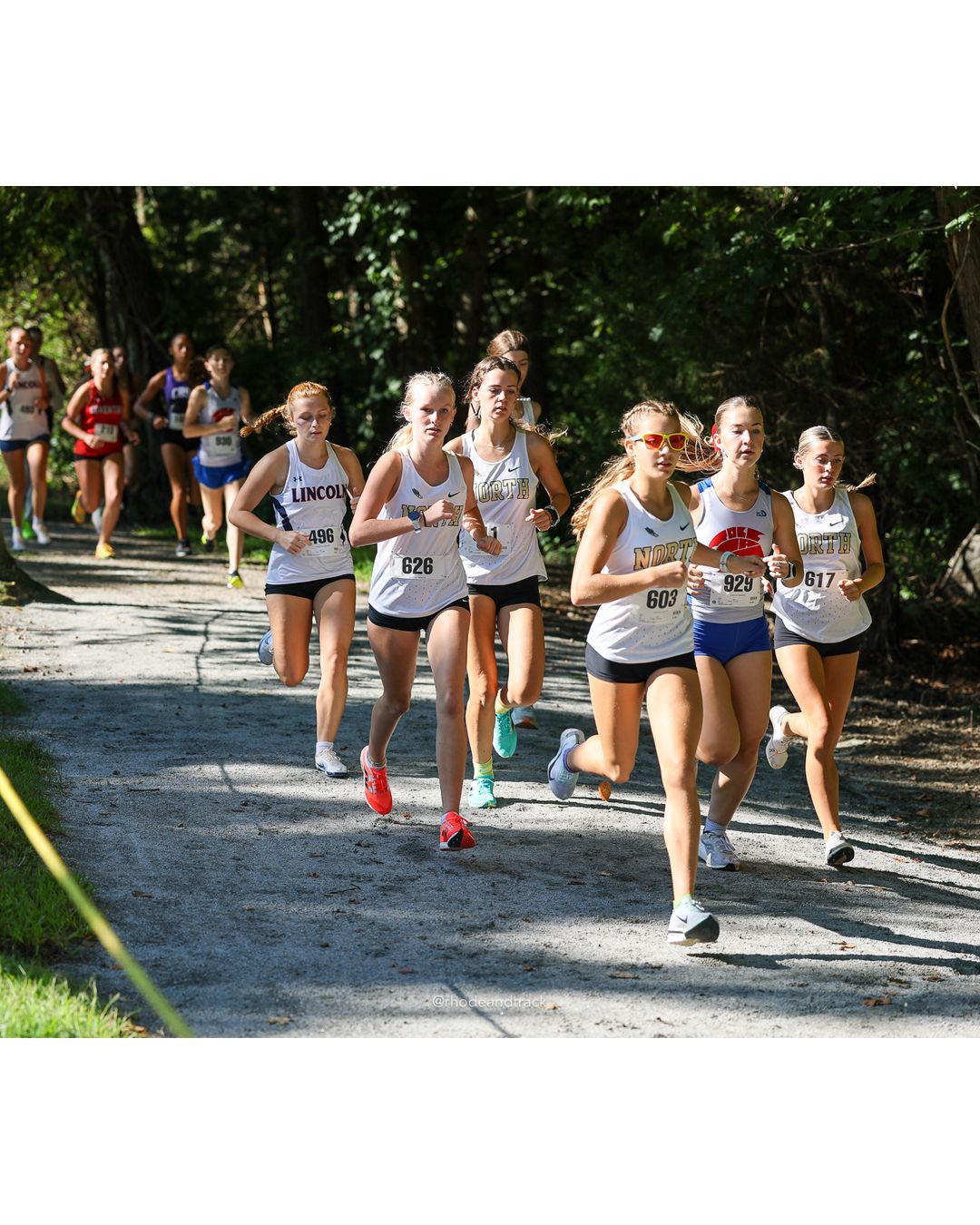 #603 Mackenzie Baker, North Kingstown High School, 5k Run - Girls (Roy), P8, 21:31.76; #626 Avrie Tighe, North Kingstown High School, 5k Run - Girls (Roy), P11, 21:40.67; #929 Nebo Amaechina, La Salle Academy, 5k Run - Girls (Roy), P19, 22:37.82 - #603 Mackenzie Baker, North Kingstown High School, 5k Run - Girls (Roy), P8, 21:31.76; #626 Avrie Tighe, North Kingstown High School, 5k Run - Girls (Roy), P11, 21:40.67 - 2026 Injury Fund Carnival XC - Deerfield Park - Greenville, Rhode Island - September 05, 2026 File: ./dir-2-5k_Run-Girls-Roy/260905-2026-injury-fund-xc-deerfield-park-183-398A5149.jpg #603 Mackenzie Baker, North Kingstown High School, 5k Run - Girls (Roy), P8, 21:31.76; #626 Avrie Tighe, North Kingstown High School, 5k Ru…