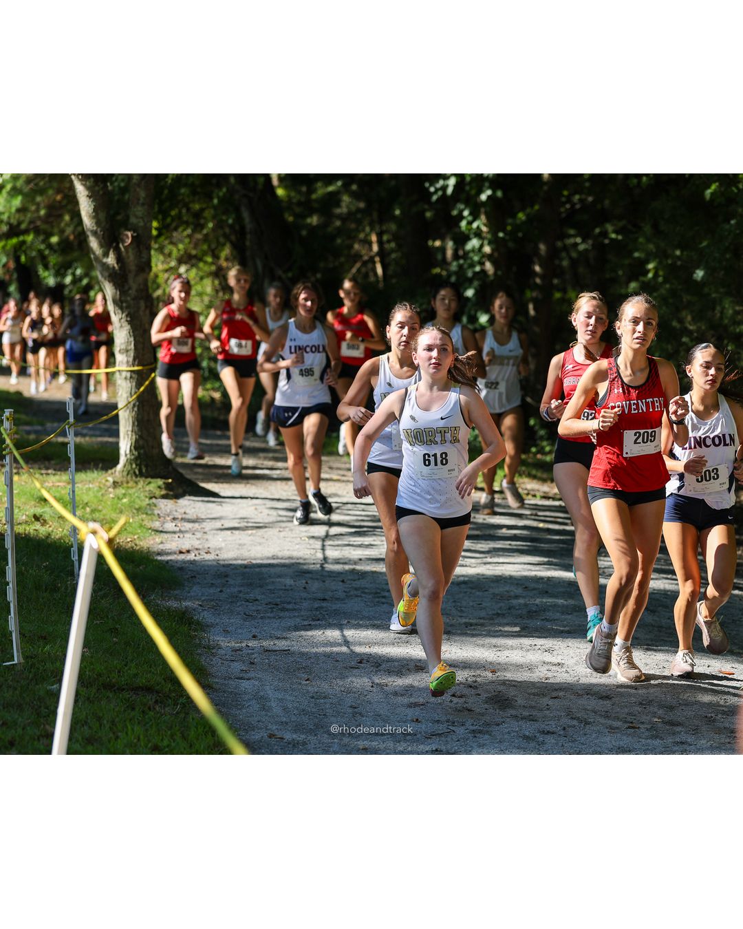 #618 Leena Neri, North Kingstown High School, 5k Run - Girls (Roy), P37, 25:06.88; #303 Jaylin Costa, Davies High School; #209 Sophia Cooper, Coventry High School, 5k Run - Girls (Roy), P40, 25:37.00 - #618 Leena Neri, North Kingstown High School, 5k Run - Girls (Roy), P37, 25:06.88; #303 Jaylin Costa, Davies High School - 2026 Injury Fund Carnival XC - Deerfield Park - Greenville, Rhode Island - September 05, 2026 File: ./dir-2-5k_Run-Girls-Roy/260905-2026-injury-fund-xc-deerfield-park-188-398A5244.jpg #618 Leena Neri, North Kingstown High School, 5k Run - Girls (Roy), P37, 25:06.88; #303 Jaylin Costa, Davies High School; #209 Sophia Coope…