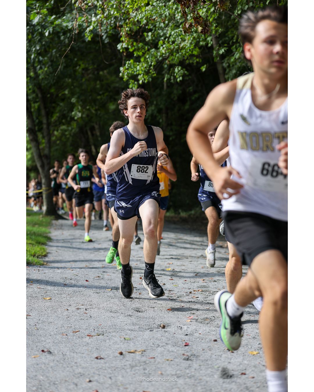 #882 Noah Bergeron, La Salle Academy, 5k Run - Boys (K Johnston), P40, 19:26.79 - #66 Jack Williamson, Barrington High School, 5k Run - Boys (K Johnston), P5, 16:56.93; #882 Noah Bergeron, La Salle Academy, 5k Run - Boys (K Johnston), P40, 19:26.79 - 2026 Injury Fund Carnival XC - Deerfield Park - Greenville, Rhode Island - September 05, 2026 File: ./dir-3-5k_Run-Boys-K_Johnston/260905-2026-injury-fund-xc-deerfield-park-295-398A6651.jpg #882 Noah Bergeron, La Salle Academy, 5k Run - Boys (K Johnston), P40, 19:26.79 - #66 Jack Williamson, Barrington High School, 5k Run - Boy…