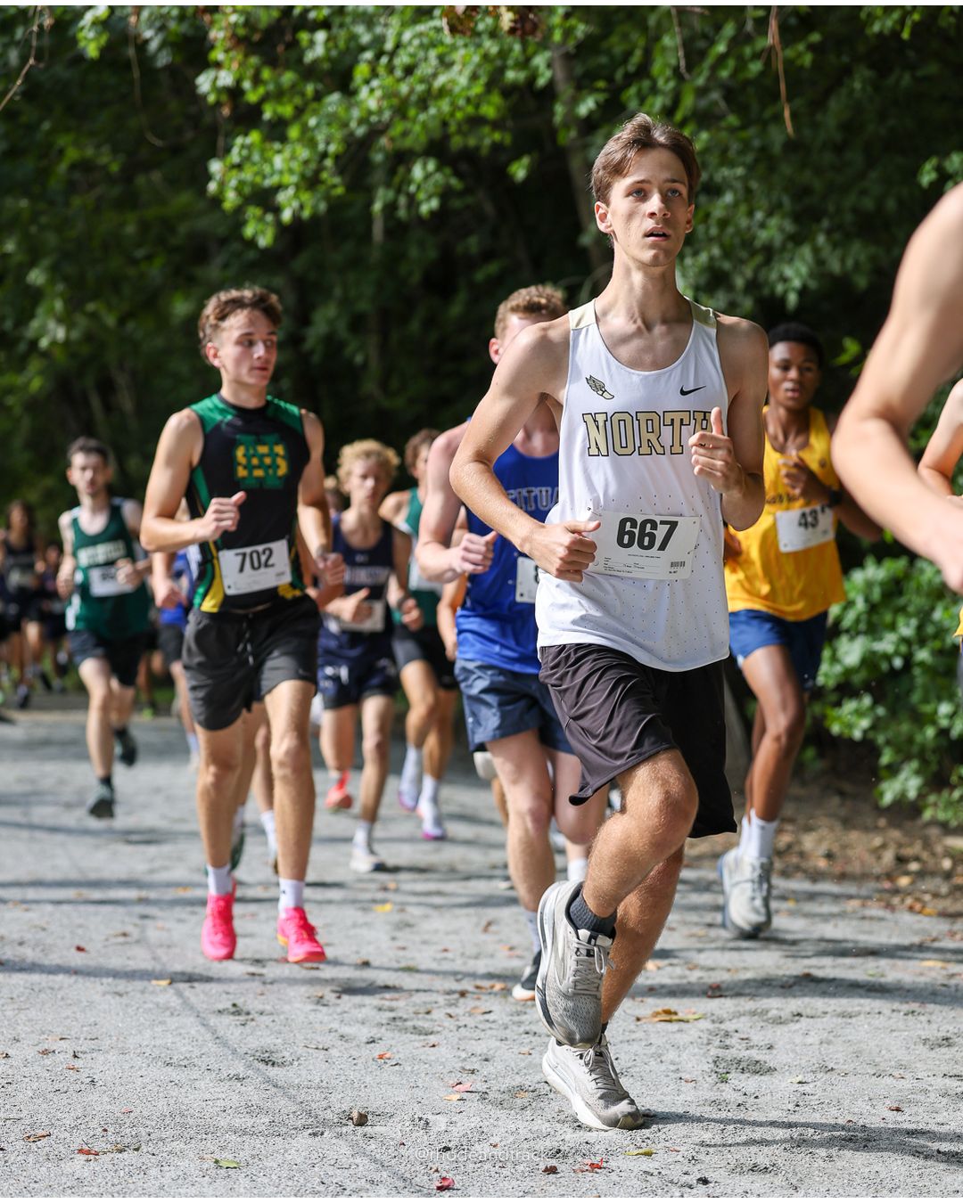 #702 Jakub Budzyna, North Smithfield High School, 5k Run - Boys (K Johnston), P67, 20:46.45 - #667 Dean Orsi, North Kingstown High School, 5k Run - Boys (K Johnston), P62, 20:35.17; #702 Jakub Budzyna, North Smithfield High School, 5k Run - Boys (K Johnston), P67, 20:46.45 - 2026 Injury Fund Carnival XC - Deerfield Park - Greenville, Rhode Island - September 05, 2026 File: ./dir-3-5k_Run-Boys-K_Johnston/260905-2026-injury-fund-xc-deerfield-park-297-398A6671.jpg #702 Jakub Budzyna, North Smithfield High School, 5k Run - Boys (K Johnston), P67, 20:46.45 - #667 Dean Orsi, North Kingstown High School,…