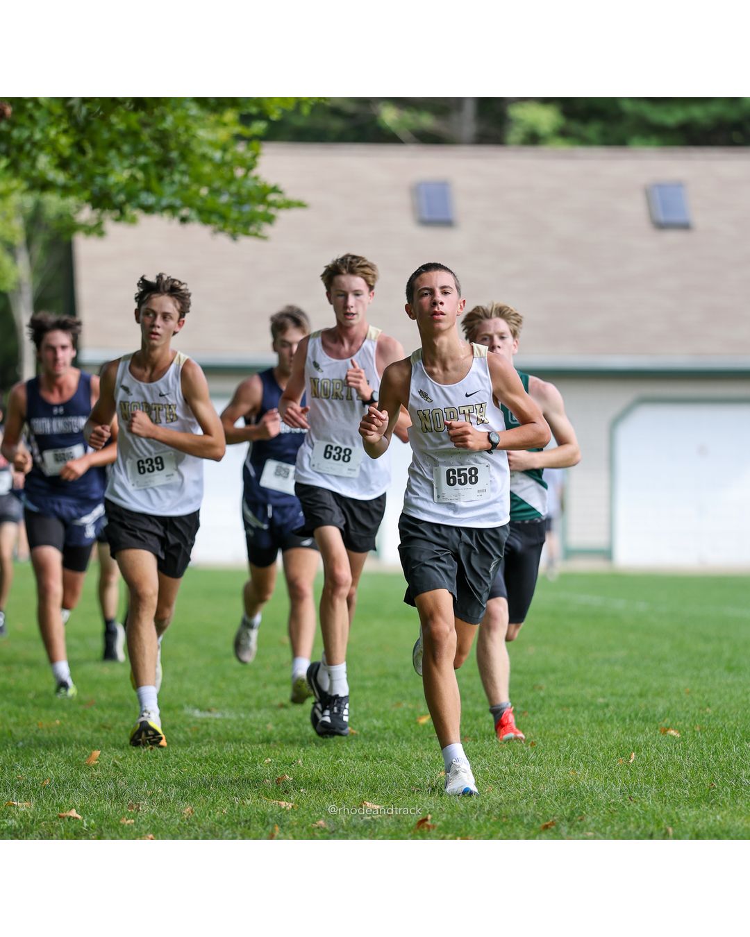 #638 Everett Coleman, North Kingstown High School, 5k Run - Boys (K Johnston), P52, 20:04.63; #658 Nathan Lugini, North Kingstown High School, 5k Run - Boys (K Johnston), P41, 19:31.14; #639 Joseph Costa, North Kingstown High School, 5k Run - Boys (K Johnston), P53, 20:11.45 - #638 Everett Coleman, North Kingstown High School, 5k Run - Boys (K Johnston), P52, 20:04.63; #639 Joseph Costa, North Kingstown High School, 5k Run - Boys (K Johnston), P53, 20:11.45; #658 Nathan Lugini, North Kingstown High School, 5k Run - Boys (K Johnston), P41, 19:31.14 - 2026 Injury Fund Carnival XC - Deerfield Park - Greenville, Rhode Island - September 05, 2026 File: ./dir-3-5k_Run-Boys-K_Johnston/260905-2026-injury-fund-xc-deerfield-park-358-398A7177.jpg #638 Everett Coleman, North Kingstown High School, 5k Run - Boys (K Johnston), P52, 20:04.63; #658 Nathan Lugini, North Kingstown High Scho…