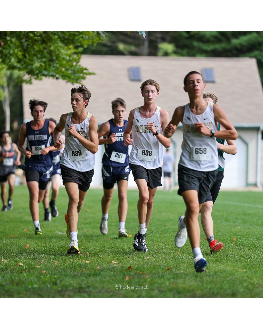 #658 Nathan Lugini, North Kingstown High School, 5k Run - Boys (K Johnston), P41, 19:31.14; #638 Everett Coleman, North Kingstown High School, 5k Run - Boys (K Johnston), P52, 20:04.63; #639 Joseph Costa, North Kingstown High School, 5k Run - Boys (K Johnston), P53, 20:11.45 - #658 Nathan Lugini, North Kingstown High School, 5k Run - Boys (K Johnston), P41, 19:31.14; #639 Joseph Costa, North Kingstown High School, 5k Run - Boys (K Johnston), P53, 20:11.45 - 2026 Injury Fund Carnival XC - Deerfield Park - Greenville, Rhode Island - September 05, 2026 File: ./dir-3-5k_Run-Boys-K_Johnston/260905-2026-injury-fund-xc-deerfield-park-359-398A7185.jpg #658 Nathan Lugini, North Kingstown High School, 5k Run - Boys (K Johnston), P41, 19:31.14; #638 Everett Coleman, North Kingstown High Scho…