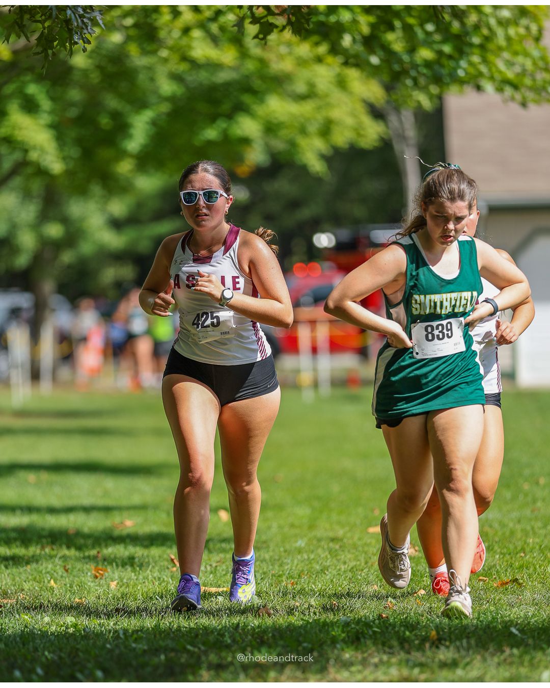 #839 Madison Burrows, Smithfield High School, 5k Run - Girls (Hindley), P39, 28:34.21 - #839 Madison Burrows, Smithfield High School, 5k Run - Girls (Hindley), P39, 28:34.21; #425 Gabriella DeRosa, La Salle Academy, 5k Run - Girls (Hindley), P36, 28:01.07 - 2026 Injury Fund Carnival XC - Deerfield Park - Greenville, Rhode Island - September 05, 2026 File: ./dir-4-5k_Run-Girls-Hindley/260905-2026-injury-fund-xc-deerfield-park-601-398A0941.jpg #839 Madison Burrows, Smithfield High School, 5k Run - Girls (Hindley), P39, 28:34.21 - #839 Madison Burrows, Smithfield High School, 5k Ru…