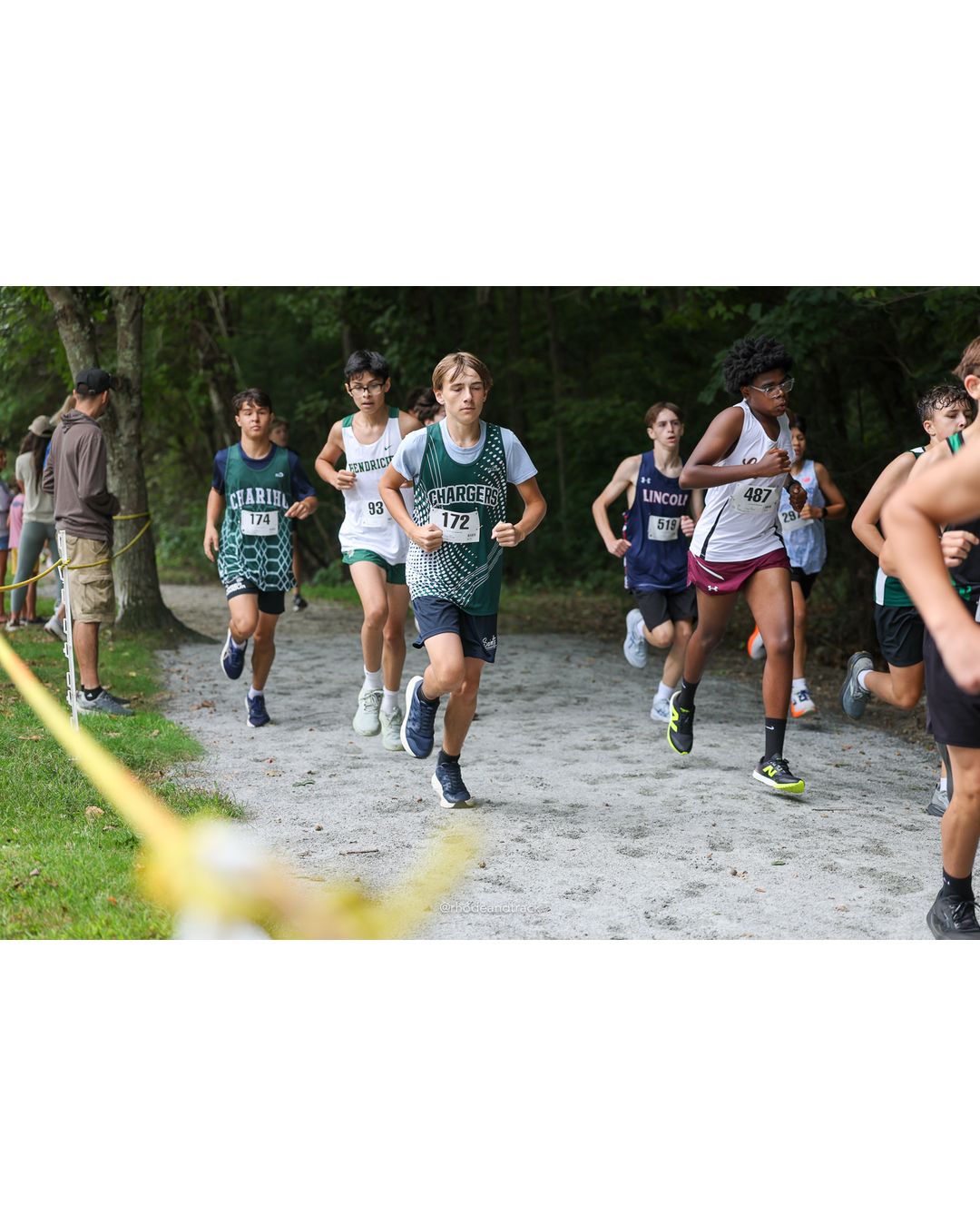 #172 Maxym Mykhaylyshyn, Chariho High School, 4k Run - Boys (Dwyer), P109, 21:32.42; #487 Andres-Jeremiah Urena, La Salle Academy, 4k Run - Boys (Dwyer), P112, 22:57.02; #93 Jionni Robles, Bishop Hendricken High School, 4k Run - Boys (Dwyer), P130, 27:26.72 - #172 Maxym Mykhaylyshyn, Chariho High School, 4k Run - Boys (Dwyer), P109, 21:32.42; #93 Jionni Robles, Bishop Hendricken High School, 4k Run - Boys (Dwyer), P130, 27:26.72 - 2026 Injury Fund Carnival XC - Deerfield Park - Greenville, Rhode Island - September 05, 2026 File: ./dir-5-4k_Run-Boys-Dwyer/260905-2026-injury-fund-xc-deerfield-park-686-398A2440.jpg #172 Maxym Mykhaylyshyn, Chariho High School, 4k Run - Boys (Dwyer), P109, 21:32.42; #487 Andres-Jeremiah Urena, La Salle Academy, 4k Run -…