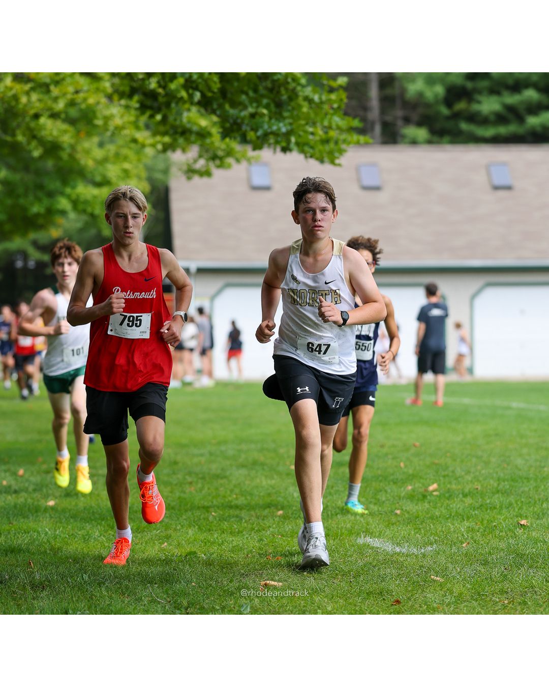 #795 Tristan Harrington, Portsmouth High School, 4k Run - Boys (Dwyer), P21, 16:50.54; #647 Graham Flippin, North Kingstown High School, 4k Run - Boys (Dwyer), P34, 17:30.65 - #795 Tristan Harrington, Portsmouth High School, 4k Run - Boys (Dwyer), P21, 16:50.54; #647 Graham Flippin, North Kingstown High School, 4k Run - Boys (Dwyer), P34, 17:30.65; #550 Cairo Carvalho, Moses Brown School, 4k Run - Boys (Dwyer), P28, 17:19.15 - 2026 Injury Fund Carnival XC - Deerfield Park - Greenville, Rhode Island - September 05, 2026 File: ./dir-5-4k_Run-Boys-Dwyer/260905-2026-injury-fund-xc-deerfield-park-735-398A2833.jpg #795 Tristan Harrington, Portsmouth High School, 4k Run - Boys (Dwyer), P21, 16:50.54; #647 Graham Flippin, North Kingstown High School, 4k…