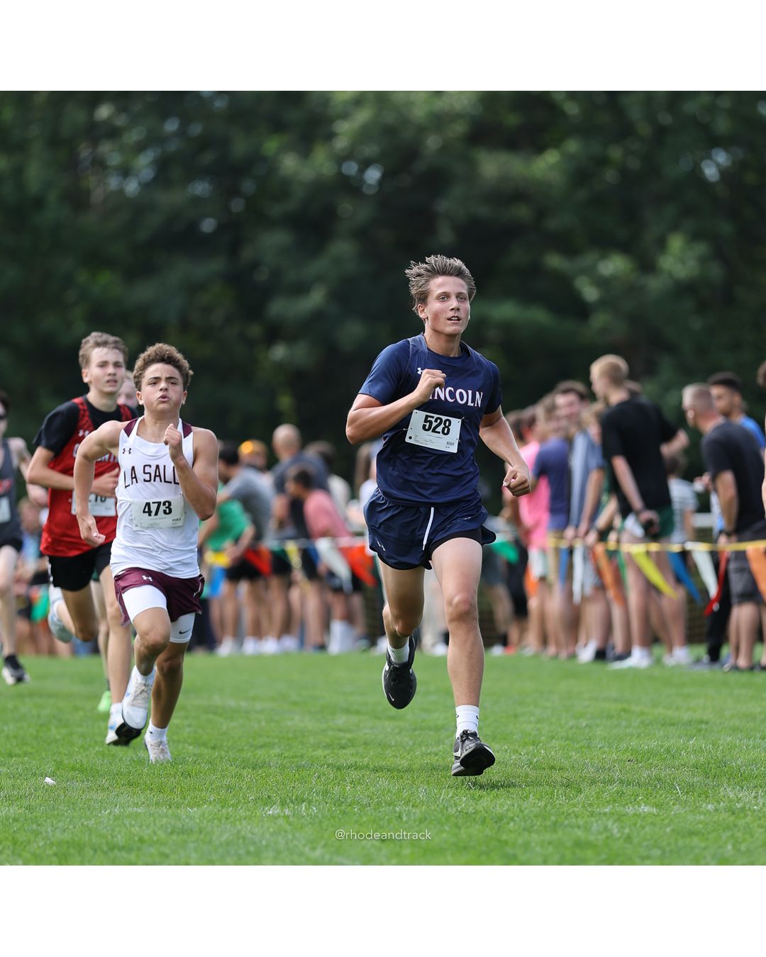 #528 Jackson Therien, Lincoln High School, 4k Run - Boys (Dwyer), P52, 18:22.01; #473 Trey Ponatrelli, La Salle Academy, 4k Run - Boys (Dwyer), P50, 18:21.12 - #473 Trey Ponatrelli, La Salle Academy, 4k Run - Boys (Dwyer), P50, 18:21.12 - 2026 Injury Fund Carnival XC - Deerfield Park - Greenville, Rhode Island - September 05, 2026 File: ./dir-5-4k_Run-Boys-Dwyer/260905-2026-injury-fund-xc-deerfield-park-845-398A4370.jpg #528 Jackson Therien, Lincoln High School, 4k Run - Boys (Dwyer), P52, 18:22.01; #473 Trey Ponatrelli, La Salle Academy, 4k Run - Boys (Dwy…