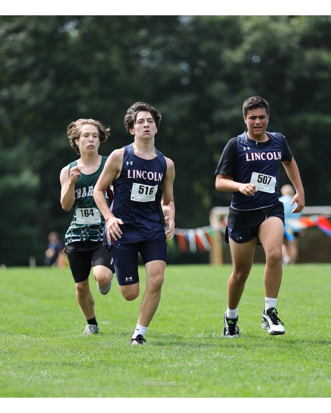 #516 Liam Gaffey, Lincoln High School, 4k Run - Boys (Dwyer), P122, 24:52.04; #507 Jace Barbieri, Lincoln High School, 4k Run - Boys (Dwyer), P124, 24:54.23; #164 Jackson Heim, Chariho High School, 4k Run - Boys (Dwyer), P123, 24:52.44 - #516 Liam Gaffey, Lincoln High School, 4k Run - Boys (Dwyer), P122, 24:52.04; #507 Jace Barbieri, Lincoln High School, 4k Run - Boys (Dwyer), P124, 24:54.23; #164 Jackson Heim, Chariho High School, 4k Run - Boys (Dwyer), P123, 24:52.44 - 2026 Injury Fund Carnival XC - Deerfield Park - Greenville, Rhode Island - September 05, 2026 File: ./dir-5-4k_Run-Boys-Dwyer/260905-2026-injury-fund-xc-deerfield-park-921-398A5377.jpg #516 Liam Gaffey, Lincoln High School, 4k Run - Boys (Dwyer), P122, 24:52.04; #507 Jace Barbieri, Lincoln High School, 4k Run - Boys (Dwyer…