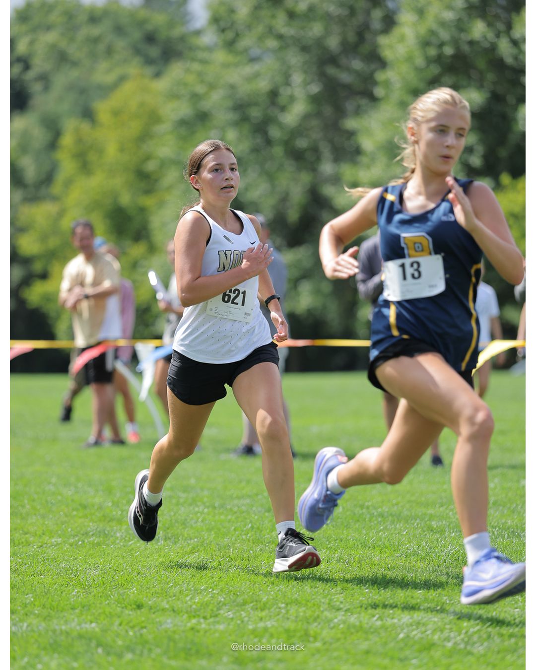 #621 Maya Reynolds, North Kingstown High School, 4k Run - Girls (Leddy), P50, 22:06.09; #13 Molly Maloney, Barrington High School, 4k Run - Girls (Leddy), P49, 22:05.61 - #13 Molly Maloney, Barrington High School, 4k Run - Girls (Leddy), P49, 22:05.61 - 2026 Injury Fund Carnival XC - Deerfield Park - Greenville, Rhode Island - September 05, 2026 File: ./dir-6-4k_Run-Girls-Leddy/260905-2026-injury-fund-xc-deerfield-park-1048-398A6823.jpg #621 Maya Reynolds, North Kingstown High School, 4k Run - Girls (Leddy), P50, 22:06.09; #13 Molly Maloney, Barrington High School, 4k Run -…