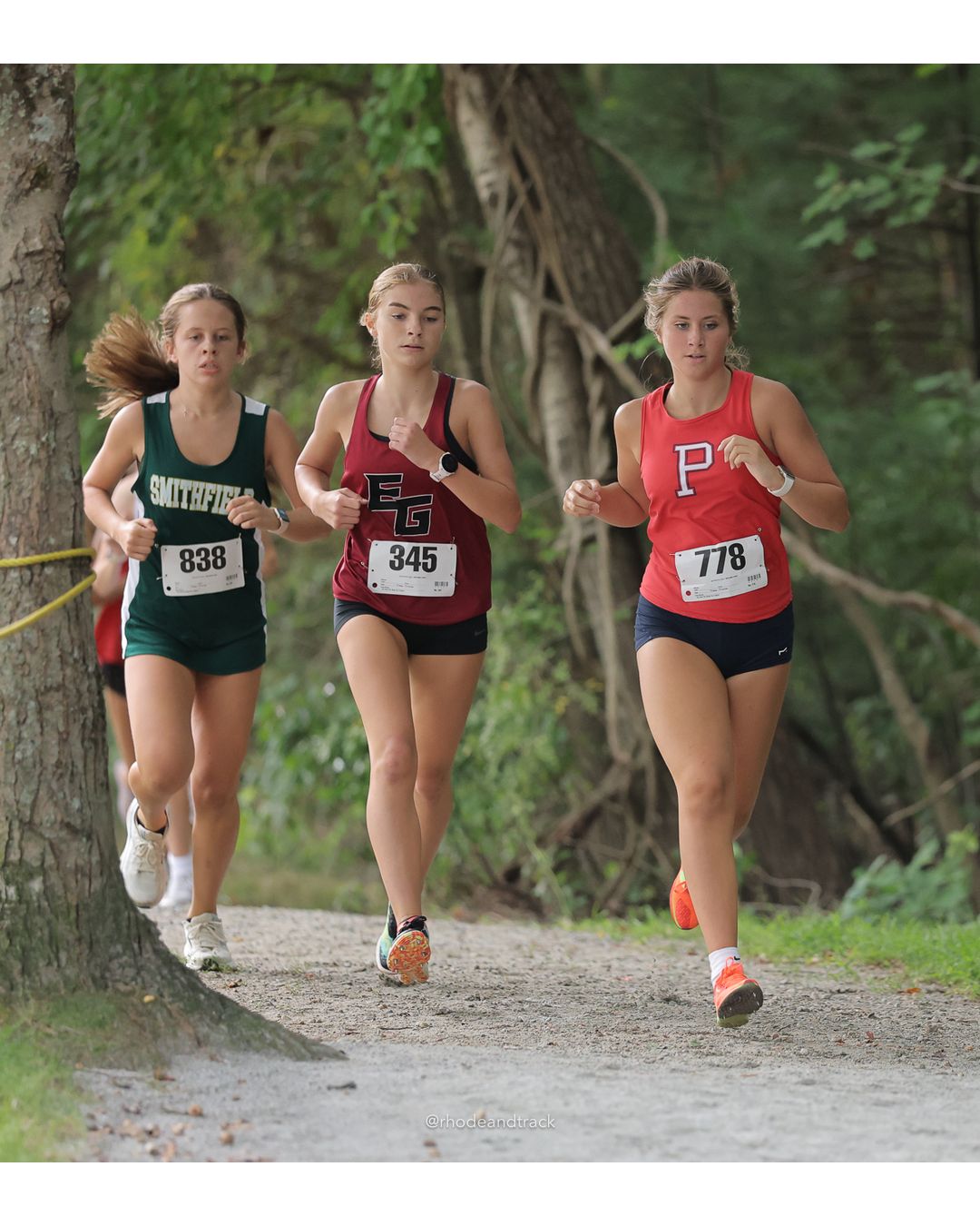#778 Angelica Christensen, Portsmouth High School, 4k Run - Girls (Leddy), P18, 18:27.66; #13 Molly Maloney, Barrington High School, 4k Run - Girls (Leddy), P49, 22:05.61; #838 Grace Borden, Smithfield High School, 4k Run - Girls (Leddy), P23, 19:05.24 - #838 Grace Borden, Smithfield High School, 4k Run - Girls (Leddy), P23, 19:05.24; #345 Emme Toce, East Greenwich High School, 4k Run - Girls (Leddy), P12, 18:00.41 - 2026 Injury Fund Carnival XC - Deerfield Park - Greenville, Rhode Island - September 05, 2026 File: ./dir-6-4k_Run-Girls-Leddy/260905-2026-injury-fund-xc-deerfield-park-937-398A5602.jpg #778 Angelica Christensen, Portsmouth High School, 4k Run - Girls (Leddy), P18, 18:27.66; #13 Molly Maloney, Barrington High School, 4k Run…