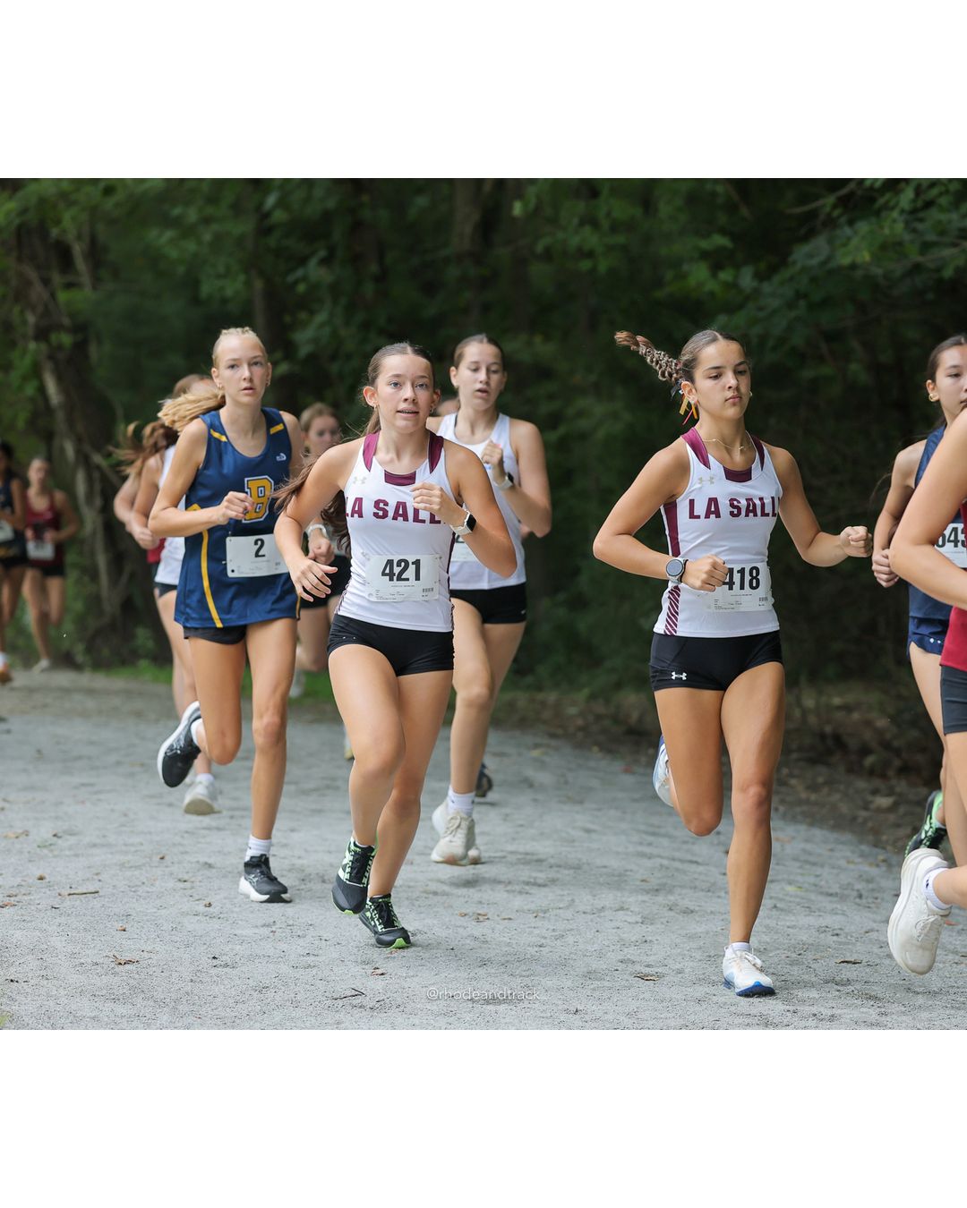 #421 Elizabeth Ceprano, La Salle Academy, 4k Run - Girls (Leddy), P25, 19:20.41; #118 Tyler Bialous, Burrillville High School; #2 Vera Jordan Bublitz, Barrington High School, 4k Run - Girls (Leddy), P17, 18:20.94 - #421 Elizabeth Ceprano, La Salle Academy, 4k Run - Girls (Leddy), P25, 19:20.41 - 2026 Injury Fund Carnival XC - Deerfield Park - Greenville, Rhode Island - September 05, 2026 File: ./dir-6-4k_Run-Girls-Leddy/260905-2026-injury-fund-xc-deerfield-park-943-398A5693.jpg #421 Elizabeth Ceprano, La Salle Academy, 4k Run - Girls (Leddy), P25, 19:20.41; #118 Tyler Bialous, Burrillville High School; #2 Vera Jord…
