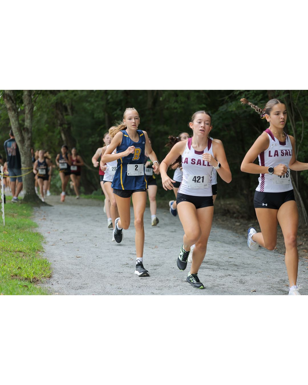 #421 Elizabeth Ceprano, La Salle Academy, 4k Run - Girls (Leddy), P25, 19:20.41; #2 Vera Jordan Bublitz, Barrington High School, 4k Run - Girls (Leddy), P17, 18:20.94 - #421 Elizabeth Ceprano, La Salle Academy, 4k Run - Girls (Leddy), P25, 19:20.41; #2 Vera Jordan Bublitz, Barrington High School, 4k Run - Girls (Leddy), P17, 18:20.94 - 2026 Injury Fund Carnival XC - Deerfield Park - Greenville, Rhode Island - September 05, 2026 File: ./dir-6-4k_Run-Girls-Leddy/260905-2026-injury-fund-xc-deerfield-park-944-398A5699.jpg #421 Elizabeth Ceprano, La Salle Academy, 4k Run - Girls (Leddy), P25, 19:20.41; #2 Vera Jordan Bublitz, Barrington High School, 4k Run - G…