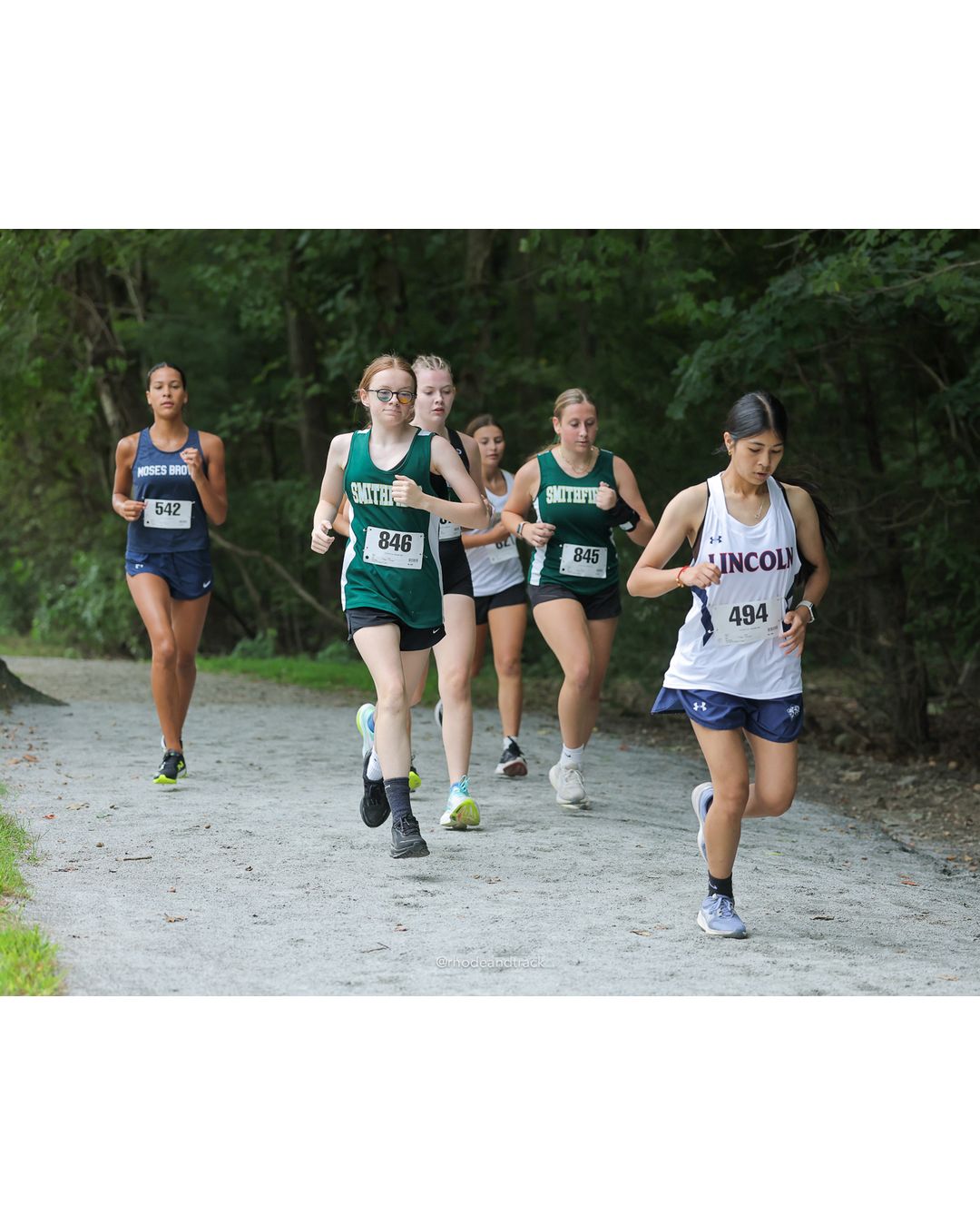 #494 Isabelle Garza, Lincoln High School, 4k Run - Girls (Leddy), P68, 26:33.69; #846 Katelyn Sanford, Smithfield High School, 4k Run - Girls (Leddy), P57, 23:56.46; #845 Brianna Mirabile, Smithfield High School, 4k Run - Girls (Leddy), P62, 25:04.70 - #846 Katelyn Sanford, Smithfield High School, 4k Run - Girls (Leddy), P57, 23:56.46; #494 Isabelle Garza, Lincoln High School, 4k Run - Girls (Leddy), P68, 26:33.69; #845 Brianna Mirabile, Smithfield High School, 4k Run - Girls (Leddy), P62, 25:04.70 - 2026 Injury Fund Carnival XC - Deerfield Park - Greenville, Rhode Island - September 05, 2026 File: ./dir-6-4k_Run-Girls-Leddy/260905-2026-injury-fund-xc-deerfield-park-954-398A5815.jpg #494 Isabelle Garza, Lincoln High School, 4k Run - Girls (Leddy), P68, 26:33.69; #846 Katelyn Sanford, Smithfield High School, 4k Run - Gir…