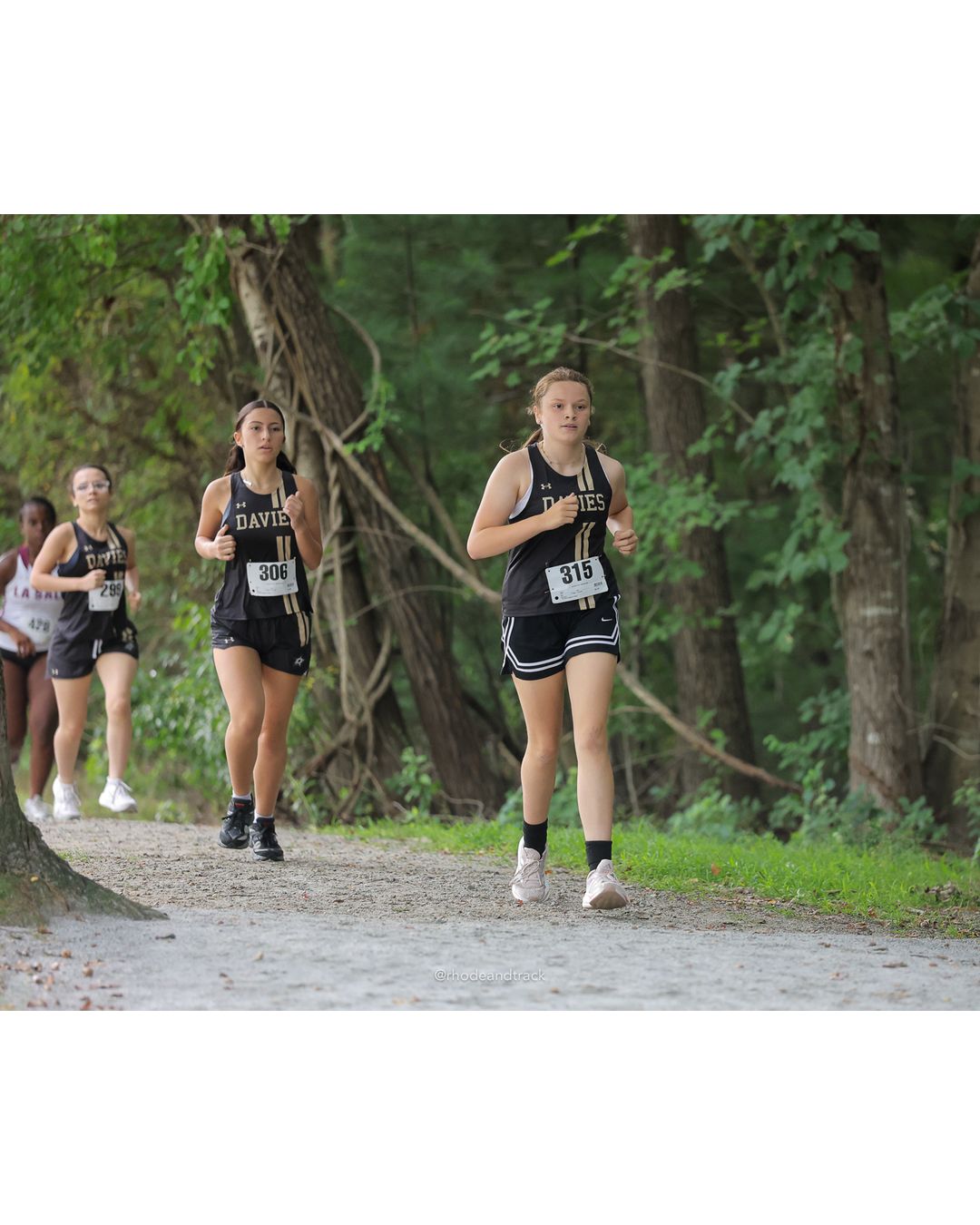 #315 Amaya Smith, Davies High School, 4k Run - Girls (Leddy), P71, 28:11.83; #306 Lillyann Liccini, Davies High School, 4k Run - Girls (Leddy), P69, 26:45.55 - #315 Amaya Smith, Davies High School, 4k Run - Girls (Leddy), P71, 28:11.83; #306 Lillyann Liccini, Davies High School, 4k Run - Girls (Leddy), P69, 26:45.55; #299 Ava Baptista, Davies High School - 2026 Injury Fund Carnival XC - Deerfield Park - Greenville, Rhode Island - September 05, 2026 File: ./dir-6-4k_Run-Girls-Leddy/260905-2026-injury-fund-xc-deerfield-park-960-398A5866.jpg #315 Amaya Smith, Davies High School, 4k Run - Girls (Leddy), P71, 28:11.83; #306 Lillyann Liccini, Davies High School, 4k Run - Girls (Led…