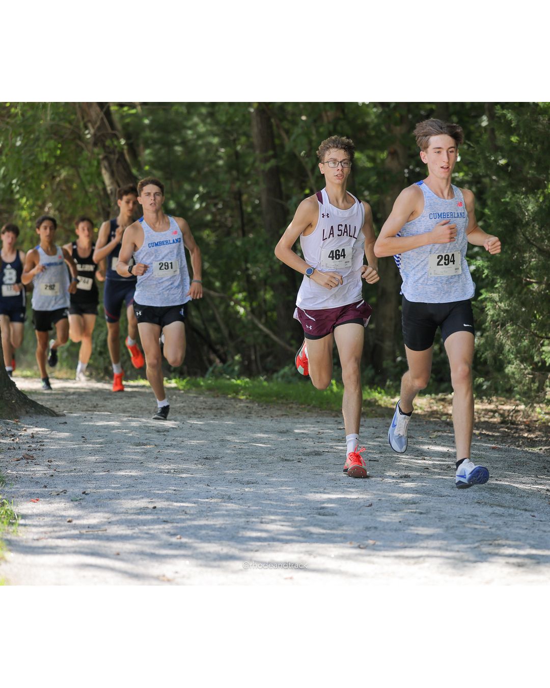 #294 Brayden Rivello, Cumberland, 5k Run - Boys (Myers), P4, 17:16.46; #464 Jackson Lewis, La Salle Academy, 5k Run - Boys (Myers), P6, 17:31.89; #291 Ethan Libby, Cumberland, 5k Run - Boys (Myers), P10, 17:47.44 - #294 Brayden Rivello, Cumberland, 5k Run - Boys (Myers), P4, 17:16.46; #291 Ethan Libby, Cumberland, 5k Run - Boys (Myers), P10, 17:47.44 - 2026 Injury Fund Carnival XC - Deerfield Park - Greenville, Rhode Island - September 05, 2026 File: ./dir-7-5k_Run-Boys-Myers/260905-2026-injury-fund-xc-deerfield-park-1069-398A7252.jpg #294 Brayden Rivello, Cumberland, 5k Run - Boys (Myers), P4, 17:16.46; #464 Jackson Lewis, La Salle Academy, 5k Run - Boys (Myers), P6, 17:…