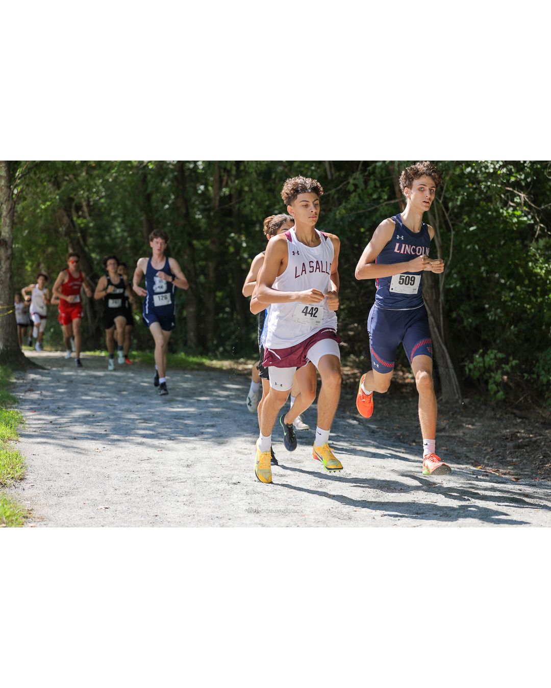 #509 Lucas Burdette, Lincoln High School, 5k Run - Boys (Myers), P30, 19:23.72; #442 Royce Aglione, La Salle Academy, 5k Run - Boys (Myers), P56, 20:56.88 - #509 Lucas Burdette, Lincoln High School, 5k Run - Boys (Myers), P30, 19:23.72; #442 Royce Aglione, La Salle Academy, 5k Run - Boys (Myers), P56, 20:56.88 - 2026 Injury Fund Carnival XC - Deerfield Park - Greenville, Rhode Island - September 05, 2026 File: ./dir-7-5k_Run-Boys-Myers/260905-2026-injury-fund-xc-deerfield-park-1071-398A7311.jpg #509 Lucas Burdette, Lincoln High School, 5k Run - Boys (Myers), P30, 19:23.72; #442 Royce Aglione, La Salle Academy, 5k Run - Boys (Myers)…