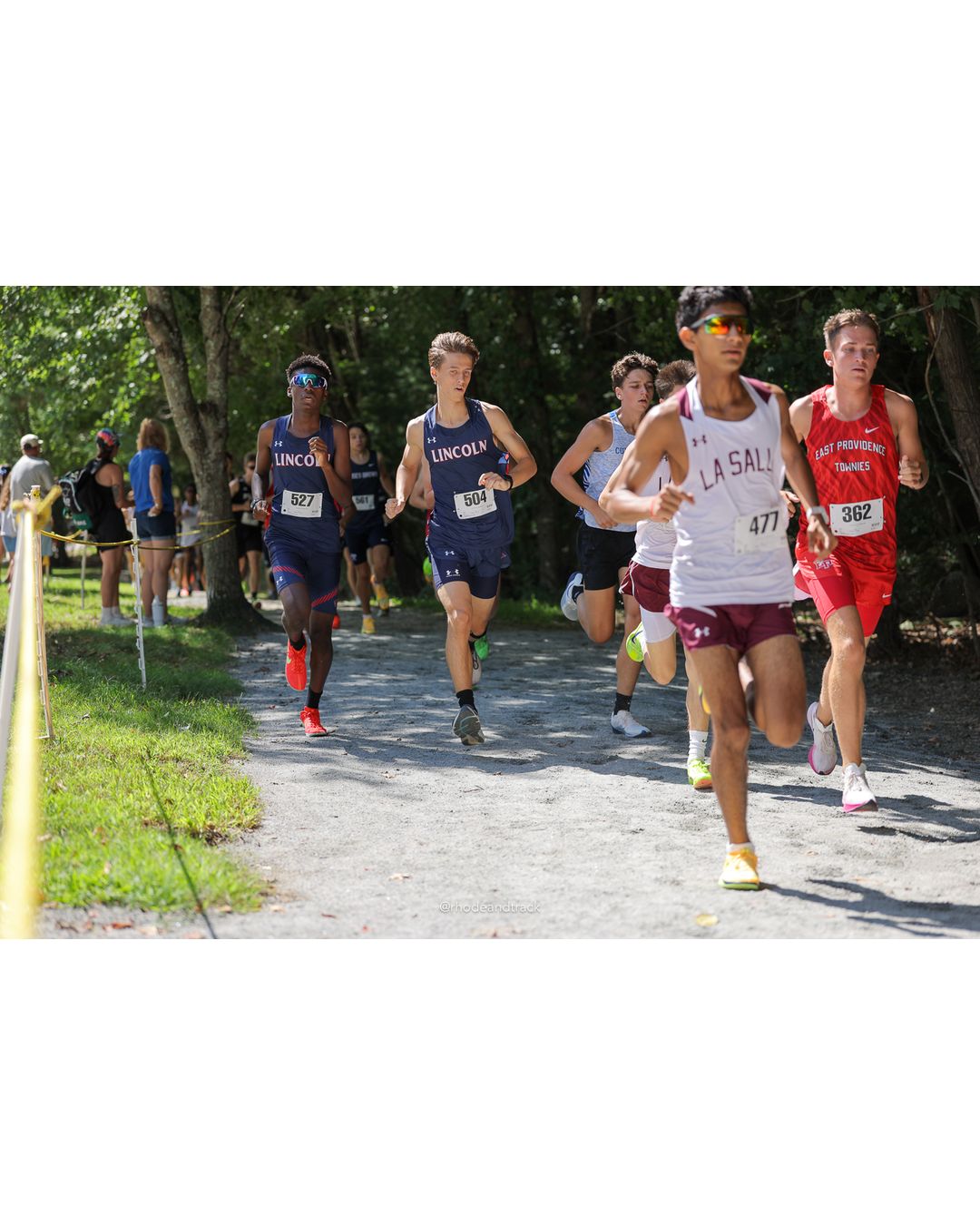 #362 Sean Black, East Providence High School, 5k Run - Boys (Myers), P19, 18:34.24; #504 George Ackerman, Lincoln High School, 5k Run - Boys (Myers), P33, 19:41.22 - #477 Sidharth Simha, La Salle Academy, 5k Run - Boys (Myers), P5, 17:26.73; #362 Sean Black, East Providence High School, 5k Run - Boys (Myers), P19, 18:34.24; #504 George Ackerman, Lincoln High School, 5k Run - Boys (Myers), P33, 19:41.22 - 2026 Injury Fund Carnival XC - Deerfield Park - Greenville, Rhode Island - September 05, 2026 File: ./dir-7-5k_Run-Boys-Myers/260905-2026-injury-fund-xc-deerfield-park-1076-398A7392.jpg #362 Sean Black, East Providence High School, 5k Run - Boys (Myers), P19, 18:34.24; #504 George Ackerman, Lincoln High School, 5k Run - Boy…