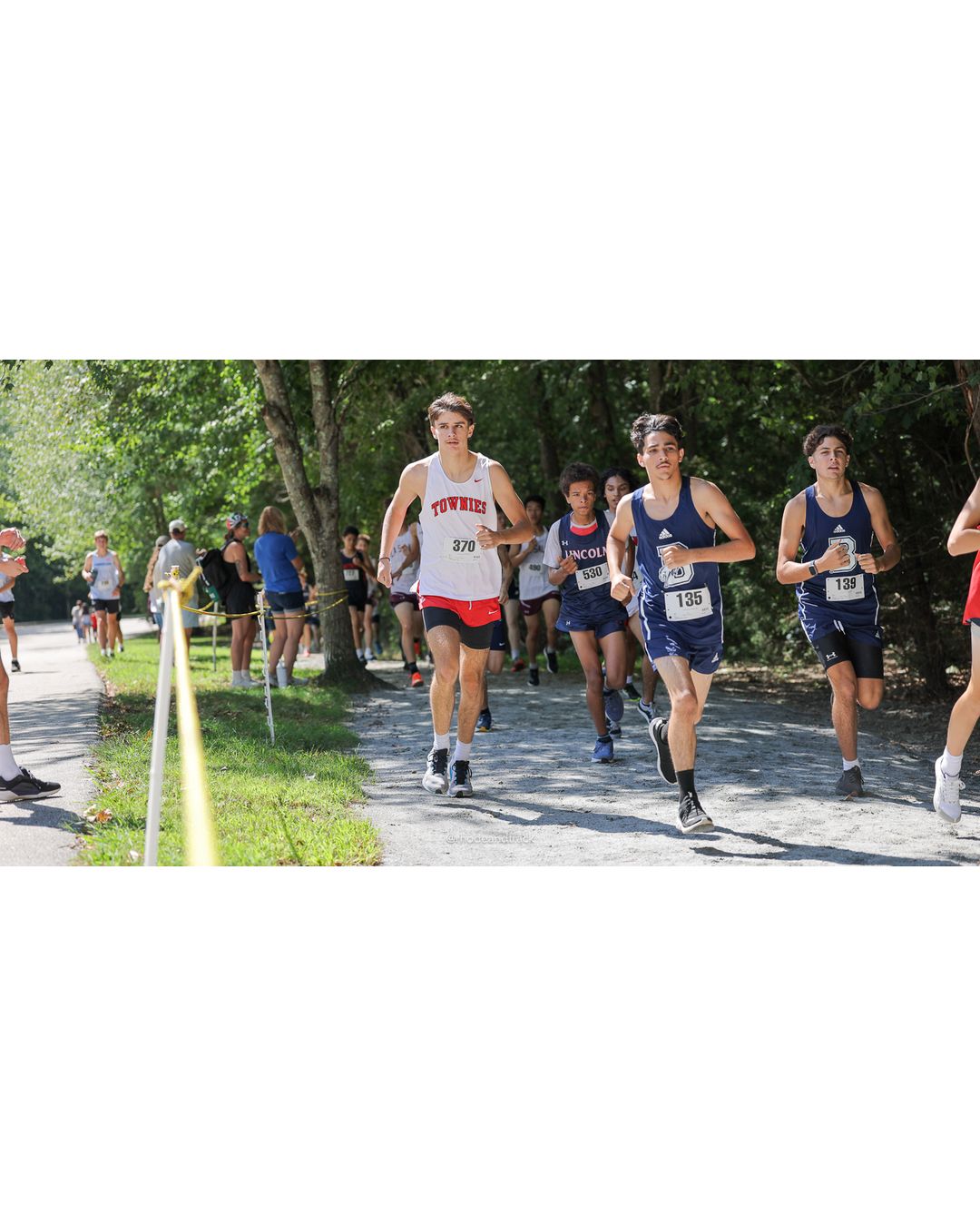 #135 Liam Nugent, Burrillville High School, 5k Run - Boys (Myers), P80, 22:18.68; #370 Roman Lonardo, East Providence High School, 5k Run - Boys (Myers), P71, 21:48.16; #530 Jideobi Washam-Unaka, Lincoln High School, 5k Run - Boys (Myers), P95, 24:02.83 - #370 Roman Lonardo, East Providence High School, 5k Run - Boys (Myers), P71, 21:48.16 - 2026 Injury Fund Carnival XC - Deerfield Park - Greenville, Rhode Island - September 05, 2026 File: ./dir-7-5k_Run-Boys-Myers/260905-2026-injury-fund-xc-deerfield-park-1085-398A7534.jpg #135 Liam Nugent, Burrillville High School, 5k Run - Boys (Myers), P80, 22:18.68; #370 Roman Lonardo, East Providence High School, 5k Run -…